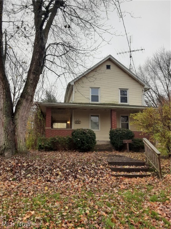 Handyman special with a 5 car garage and a 2 car garage.  House has 2 bedrooms, 1 bath, living room, dining room & kitchen.  Updated electric.  Make offer- great investment.