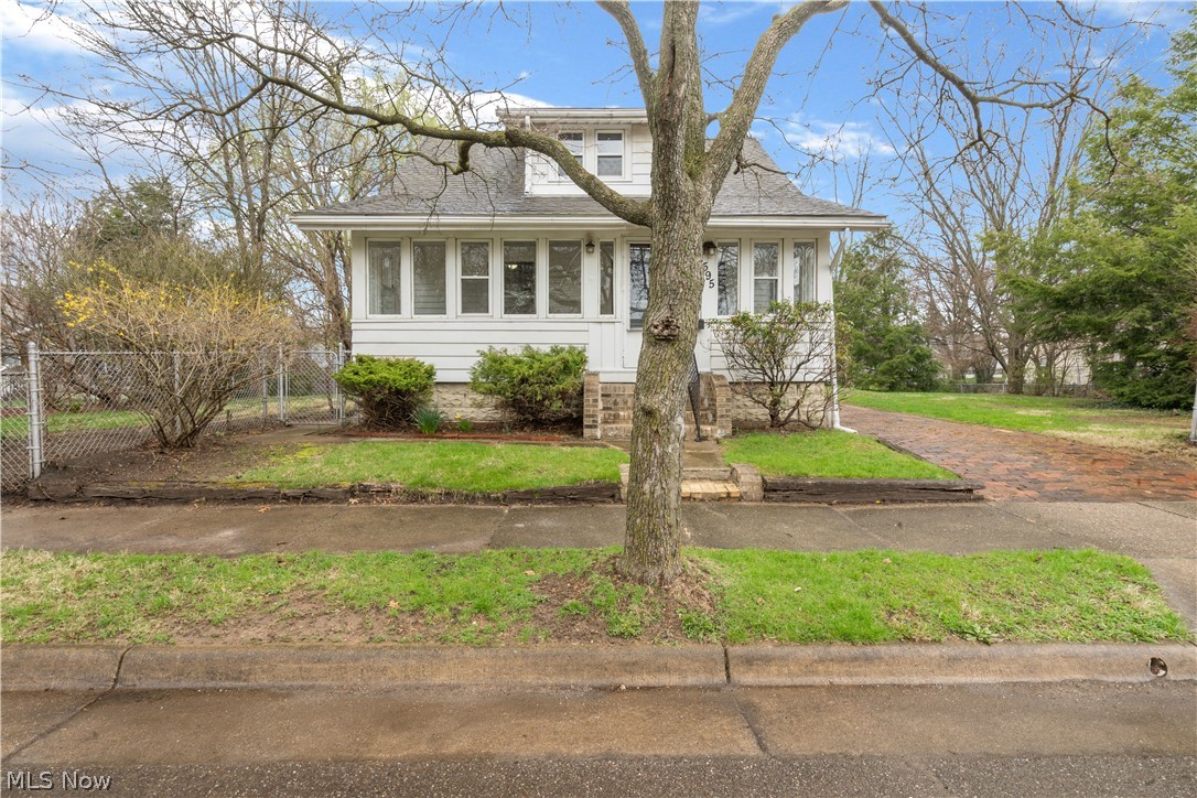 Situated on THREE parcels,  this move-in-ready Cape Cod features three bedrooms, a full bath, and a fully fenced-in yard! The enclosed front porch takes you into the living room which has wonderful wood trim that can be found all throughout the home. Right next door is the dining room that has built-ins and a bench for seating! The kitchen features beautiful wood cabinetry that gives you plenty of cabinet space. Plus laminate flooring, and counters. Right off of the kitchen, you have the screened-in porch that gives you access to the backyard. You'll find one of the bedrooms on the main floor, which has overhead lighting, and is wonderfully sized! Completing the first floor is the full bath that has a single wood vanity with storage underneath. Plus a shower/tub combo! Upstairs you will have two more bedrooms. The master bedroom is greatly sized and features a HUGE walk-in closet! The other bedroom has more overhead lighting and ample closet space. Outside you'll find a two-car detache