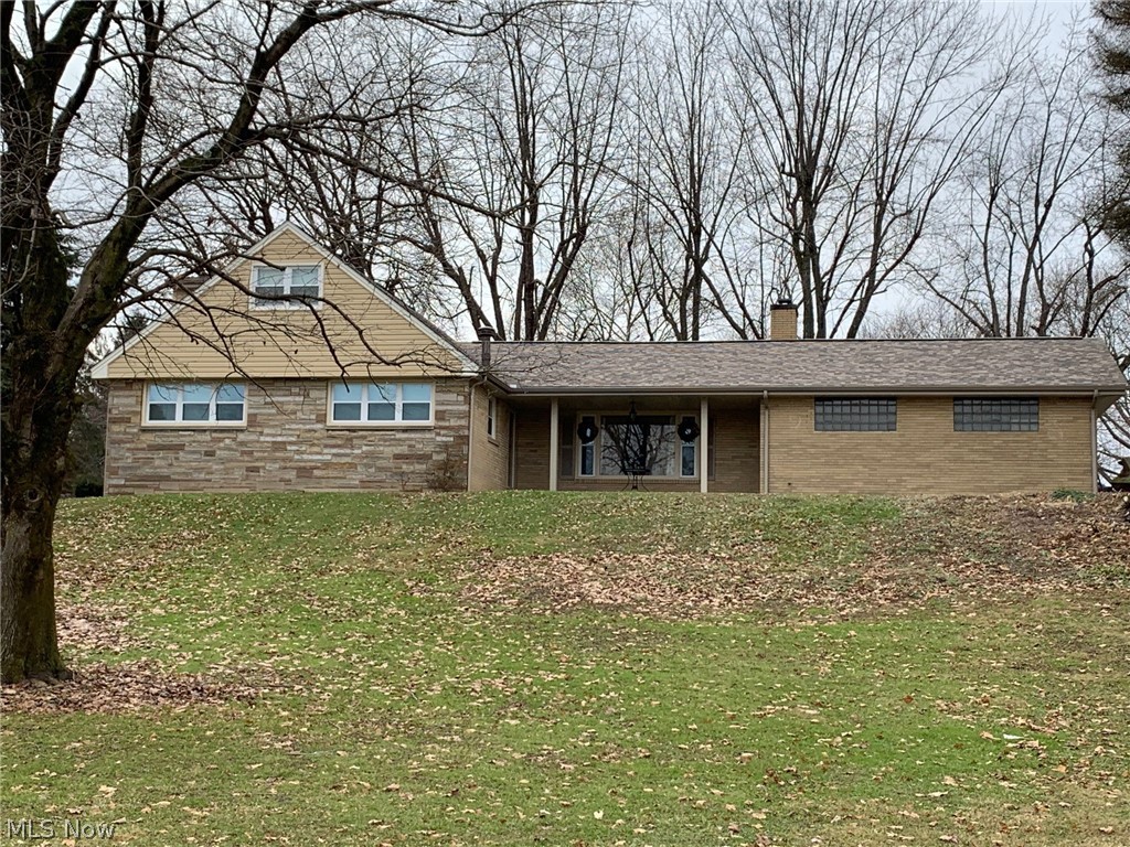 Don't let this newly renovated 4 bedroom, 2 bathroom home pass you by! This renovation project was completed making astonishing changes to both, the interior and exterior of the home. The exterior has been refinished with newer vinyl siding and roof, as well a new sidewalk extending from the driveway to the rear patio.  Then take a walk inside, where you will find a modern concept with a fully renovated kitchen with all new stainless steel appliances, granite counter tops, and porcelain tile floor for entertaining and dining. Then relax in the living room with family and friends and enjoy the custom built mantle and stunning electric fireplace! The first floor features the master and 2nd bedroom, upstairs is two additional bedrooms with bath. Don't worry, with all new gas HVAC and custom made FAUX wood blinds! Think you still need more room? Then take a walk downstairs to the finished basement with carpet floors, rec. room, fireplace, and storage/laundry room! No need to fret about you