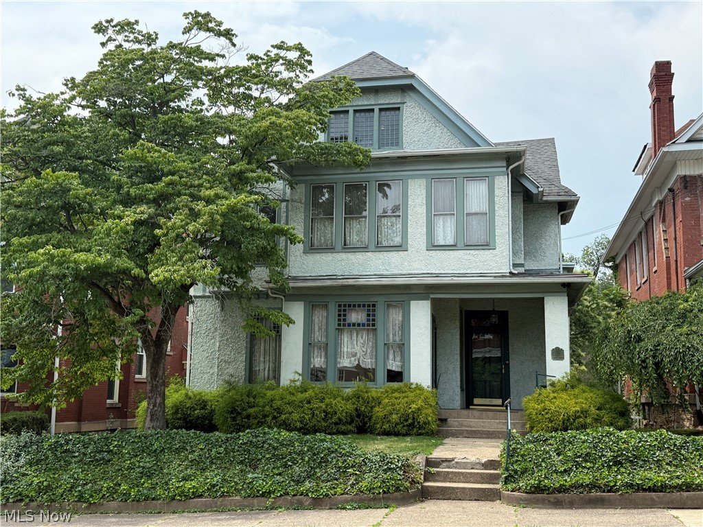 This Historical beauty has so much to offer from her 8 bedrooms to her library, garden room, and her music/ parlor room.The home has been finished on 3 floors and partially finished basement. There is a 3 car garage that needs some work, and a nice back yard as well. The old school charm in this house is amazing, including a fireplace with a mantel in almost every room, stained glass windows,beautiful built ins throughout, pocket doors, unique hinges on the lovey huge wooden doors. The hardwood that run all through the home are remarkable. The kitchen has been modernized custom built cabinets and Corian countertops all around, with Corian also on the large center bar. There is storage everywhere in this home. Including a very large pantry in the kitchen and huge Walkin closets in the main bedroom. The beautiful trim and window shutters and just the right touch. The home was built in 1885 and added onto in 1910 and more add ons in 1940. Come see for yourself. It’s really something!
