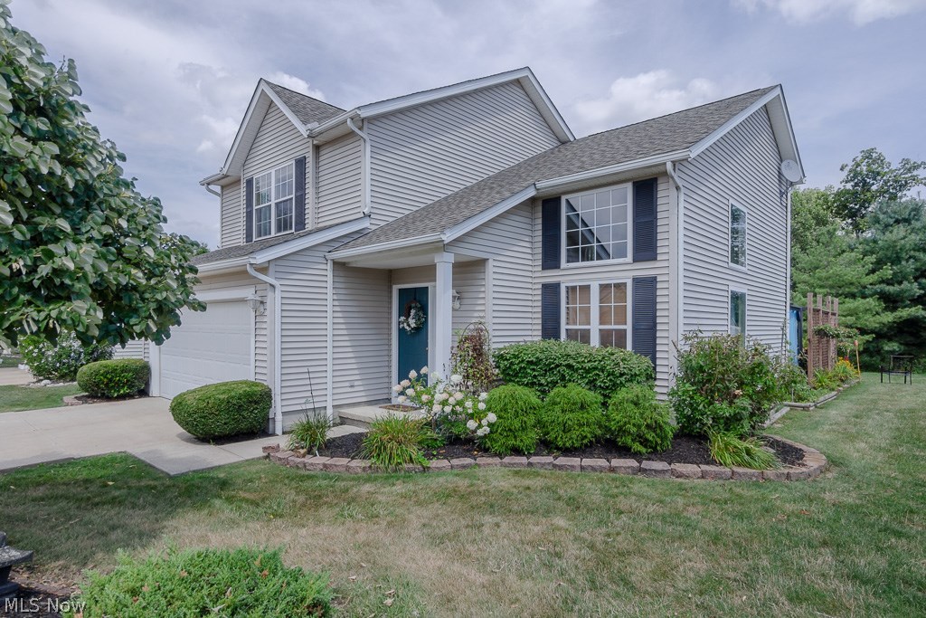 Welcome to your next home!  Move in ready with freshly updated and current finishes.  Enjoy the year round beauty of the trees backing up to Plum Creek Park from the  24 x 19 stamped patio that feels like an outside living room.  Open kitchen, eating and family room with cozy fireplace for cool days.  New stainless backsplash, countertops, sink, faucet and new stainless appliances.  Convenient laundry off of the kitchen. Upstairs balcony overlooks bright and roomy living and dining rooms with new flooring.  Expansive windows and lovely granite topped dry bar with glass shelves makes entertaining enjoyable.  Large vaulted ceiling master suite with walk in closet and attached bath with linen closet for storage.  Additional 2 bedrooms and full bath round out the second floor.  
Walking paths in development back up to beautiful Medina County Park System's Plum Creek Park.  Call your agent to get an immediate showing!
