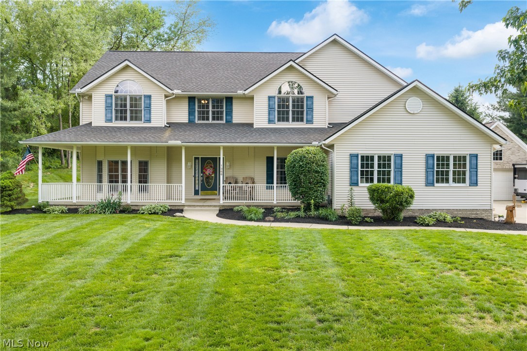 Welcome to this custom built colonial home located in desirable Coventry School District.  This inviting abode offers four bedrooms and two and a half bathrooms.  This stunning home is situated on a spacious one acre lot. When you walk up to the front door, there is a wrap around porch, beautiful landscaping, and an awesome yard.  This home offers an open floor plan.  There is a two story sunken great room with a floor to ceiling stone fireplace, flanked by a wall of windows with views of your private yard.  There is a fabulous oak eat-in kitchen that boasts stainless steel appliances, ceramic tile flooring, and granite countertops.  There is also a private office with french doors on the main floor.  Don't forget about the first floor laundry.  Enjoy summer evenings in the sunroom.  Enjoy summer BBQs on the back deck.  All of the bedrooms are situated on the second floor.  The primary bathroom has been recently updated.  Don't forget the finished space in the basement.  There is a rec room perfect for entertaining and plenty of storage space.  All of this plus a three car attached garage and a two car detached.  Recent updates include HVAC in 2024, Roof and all skylights in 2025, Water Softener in 2025, Chimney Sweep in 2023, and the Hot Tub in 2023. This home is located minutes from Portage Lakes.  This home has been lovingly maintained and is awaiting a new owner.  Call to schedule a showing today to make this your new address.