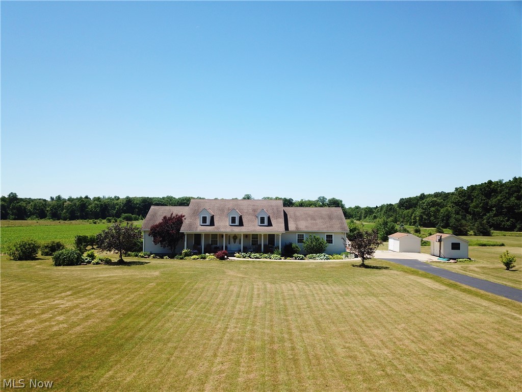 Beautifully maintained Ranch on 3.19 acres in the Berkshire School District.  Open concept Living room, Eat in Kitchen with large pantry and Dining room with sliders to the oversized deck.  2 bedrooms with an office and 2 full bathrooms.  The laundry room connects the In-law suite that has a Kitchen with access to the back deck, bedroom, full bathroom and its own ramped entrance to the Living Room.  Lower level is partially finished, plumbed for another bathroom and has a entrance/exit to the back yard.  Open Front Porch and Lush landscaping surrounds the house.  2 car garage currently has another ramp and ample attic space above.  2 sheds/outbuildings.  Close proximity to Claridon Woods Park and the Highland Trail.  1 year Home Warranty included.