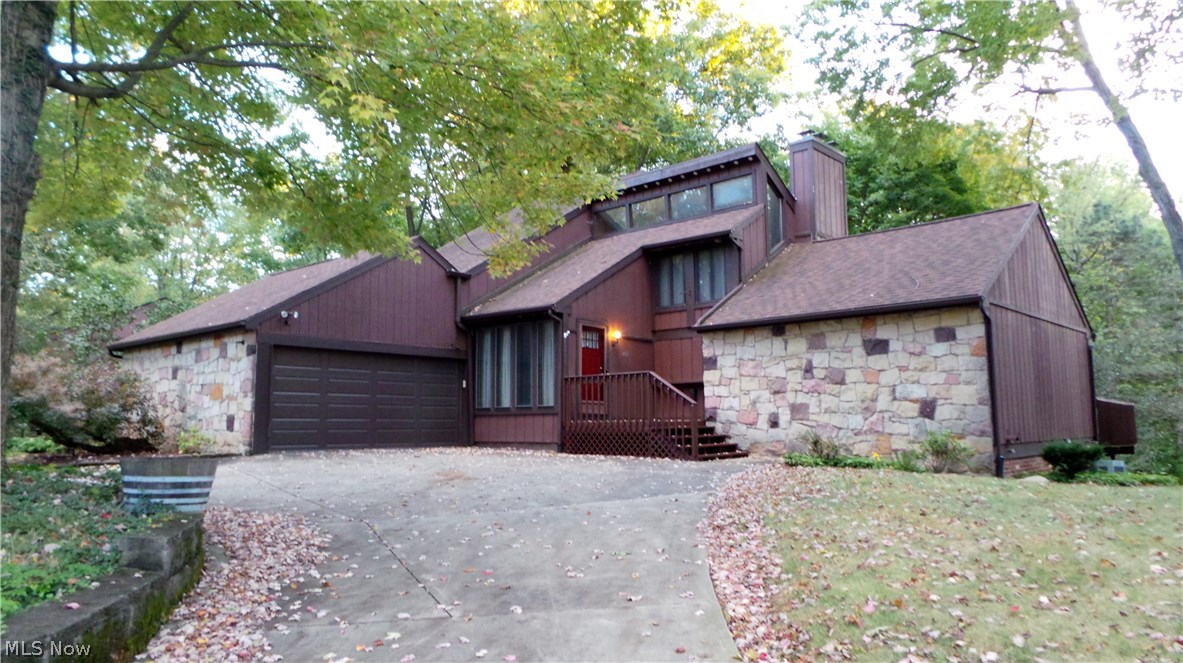 Don't miss the opportunity to own this 4 bedroom condo. Offering three floors of living space. Upper level offers a loft, full bath and 2 bedrooms, main level has an open kitchen- dining area, great room with stone fireplace, half bath, laundry room, master with master bath. The sun porch off of the dining area  to a deck reaching across the back of condo with access to the master bedroom. Lower level has  large open area with a second fireplace, another bedroom and sliding door to a wonderful patio. Very unique condo with plenty of living space. HOA FEE COVERS  Exterior Building, Landscaping, Reserve Fund, Snow Removal, Trash Removal.