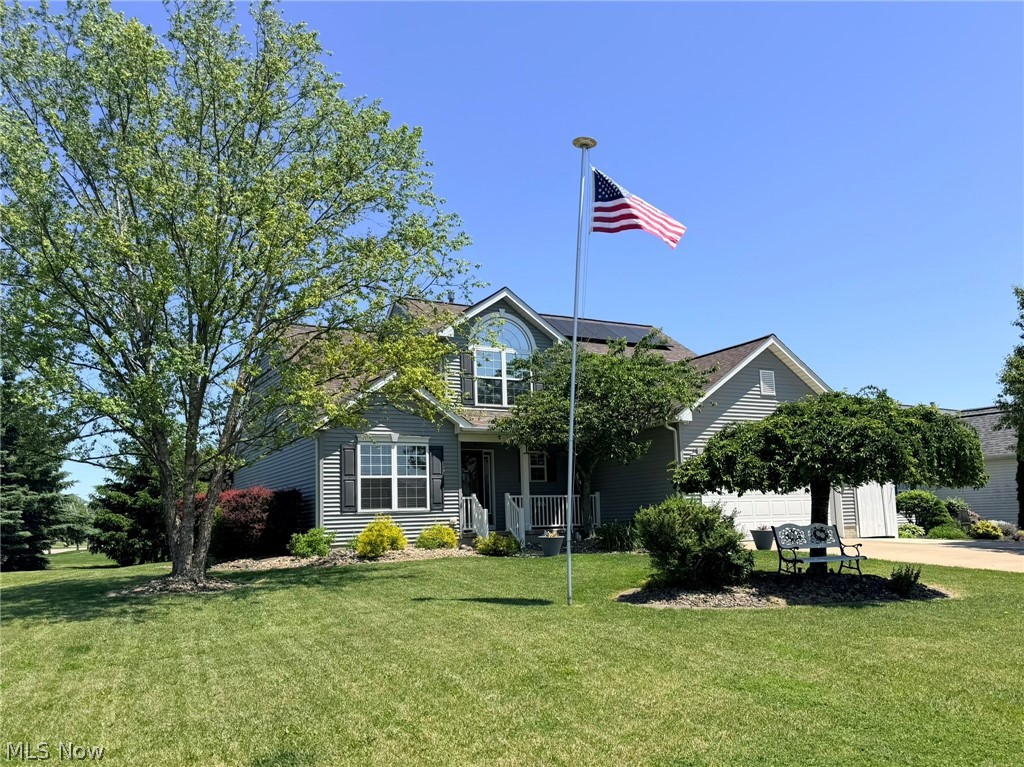 This gorgeous 3 bedroom 2 full, 2 half bath home built for first floor living is a must see! This home features an open floor plan with vaulted ceilings and a cozy fireplace. The kitchen is a dream with beautiful quartz countertops and a large island perfect for entertaining as well as a separate dining room. Dishwasher, stove, and microwave were all updated in 2025. This home provides a first floor master suite with a full bath and first floor laundry! There is a lovely 4 season room that is heated/cooled with a hot tub for extra relaxation. Upstairs has two more bedrooms and a full bath. The partially finished basement offers a half bath and extra living space as well as tons of storage and a newer hot water tank replaced in 2024. Enjoy relaxing on the front porch or back patio area ideal for warm weather entertaining. New roof was put on in 2023 with solar panels that save on your energy bill.  Schedule your showing today to see this lovely home!