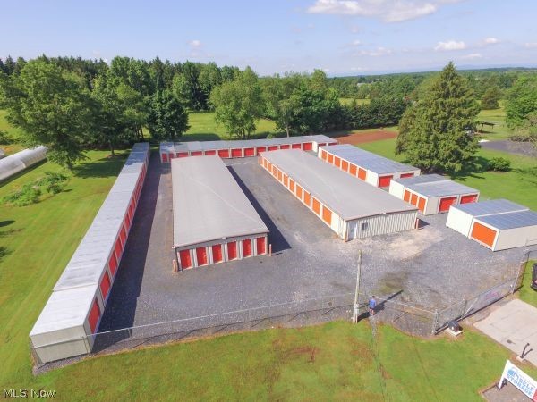 What an opportunity to build your own STORAGE UNITS!!!! This 6.23-acre mixed-use land offers pre-designed plans to build on average 192 storage units! Enjoy this prime location with high traffic area across from the popular Boettler Park and only minutes to Akron-Canton Airport. Attached are the architect -designed plans to give you a variety of options for placing your storage units. Enjoy dual entrances, both from Massillon Road and Koons Road. This is the TO BE BUILT land. Photos are not actual and only represent ideas of the exterior layout of the storage units.