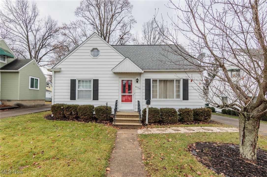 Welcome to this charming Cape Cod home, nestled in a peaceful neighborhood in Cuyahoga Falls. Boasting 3 spacious bedrooms and 2 full baths, it offers a perfect balance of comfort and functionality. Step inside to discover a warm and inviting living space featuring  hardwood floors, and abundant natural light. The kitchen showcases stainless steel appliances and butcher block countertops. The main level includes two versatile bedrooms, perfect for guests or a home office, while the upper level features a generously-sized bedroom. Outside, enjoy a large backyard with a deck—perfect for relaxing or hosting gatherings. Additional features include a detached garage with a covered patio, and full basement with a finished area and full bath. Conveniently located near schools, shopping, and parks, this home is a must-see!