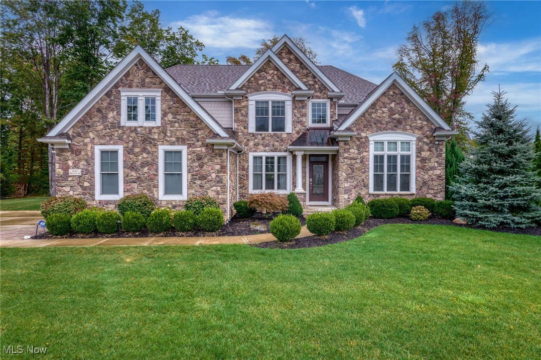 Elegant Kopf-built Legacy Pointe home offering over 4,100 sq ft of luxury living. Perfectly situated on a spacious cul-de-sac lot, this 4-bedroom, 3.5-bath home combines thoughtful design with modern finishes.

Step inside to a dramatic two-story great room with gas fireplace, open to the chef’s kitchen featuring a gas cooktop with vented hood, wall oven, large center island, and bright dining area that flows into the sunroom overlooking the private backyard. A formal dining room, walk-in pantry, and spacious first-floor office add convenience and function.

The first-floor owner’s suite is a true retreat, complete with a second fireplace, two walk-in closets, and a spa-like bath with dual vanities, jetted tub, and oversized walk-in shower. Upstairs, find three additional bedrooms (one with private bath, two with Jack & Jill), plus two open lofts—ideal for a playroom, study space, or optional fifth bedroom. 

Hardwood floors, built-in sound system, and a 10-ft ceiling. Basement (plumbed for a full bath) provide incredible potential. Outdoors, enjoy a private backyard with endless possibilities for entertaining. A 3-car garage offers ample storage.

Located in sought-after Legacy Pointe, with access to pool, golf, and fitness amenities—this beautiful home is a rare opportunity to skip the wait of new construction and move right in.