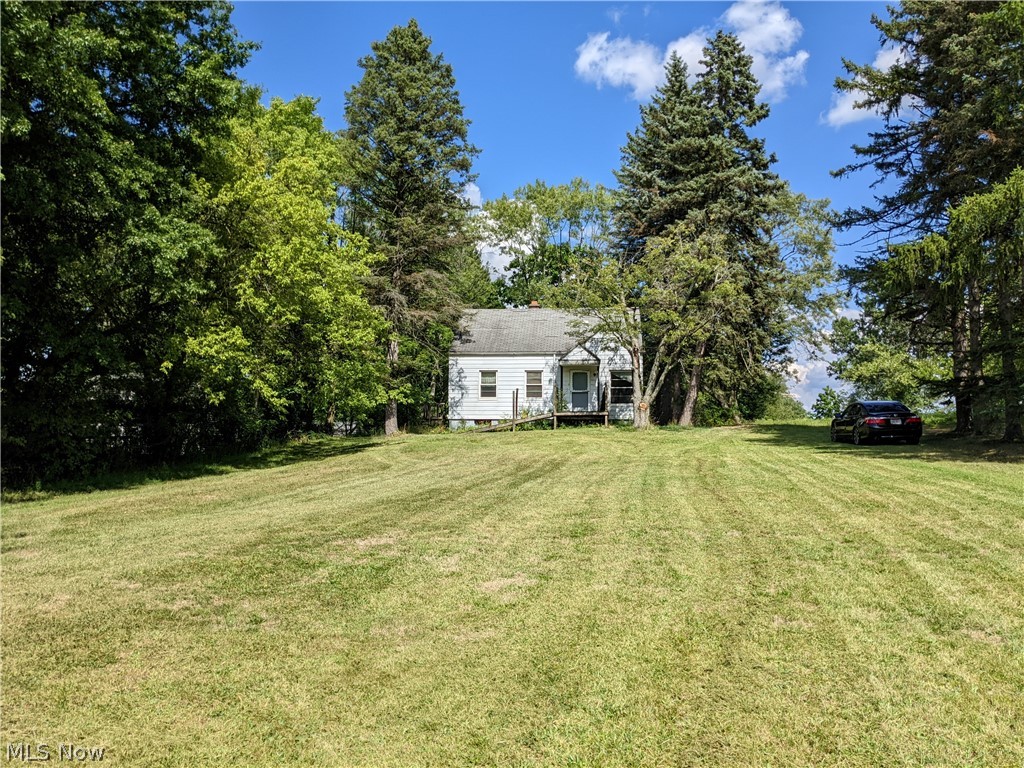 Endless opportunities awaits, Beautiful extra deep 72 X 355 wooded lot zoned E-1 high drive by traffic count that could still be used as residential according to the city. Lots of potential in this all original 1008 Sr. Ft. Cape with 3 bedrooms 1 full bath setting back off of the road. Can you Imagine the possibilities here. Run your business out of your own place, build on to expand your options. 
Not for the squeamish wanting to try out rehabbing, this is a real redo property needing a complete overall rehab from top to bottom including connecting to city water (about $1,258.00) and updating and or replacing the septic system. Even though it needs redone a lot of improvements value has been added into it because of the opportunity employment zoning.