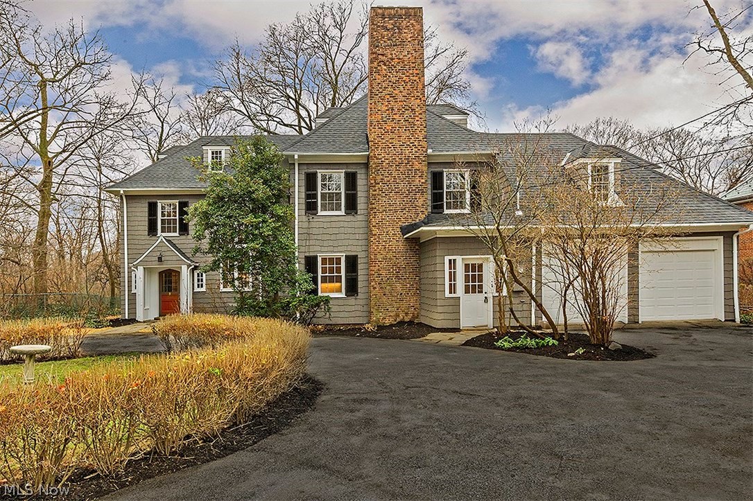 Exquisitely restored to its original beauty, this stately colonial is completely renovated with striking finishes and modern amenities. Neutral colors, rich hardwood floors, and charming architectural details create a timeless atmosphere in every room. The formal living room is complete with a fireplace, lovely built-ins, and a sitting area with a curved wall of windows overlooking the backyard. From there, walk into the dining room, which opens up to the family room with vaulted ceilings and doors leading out to the back patio. The kitchen is absolutely stunning showcasing stainless steel Fisher Paykel DCS appliances, a wine cooler, gorgeous granite countertops, subway tile backsplash, and a breakfast bar. Upstairs, the original grand staircase takes you to the master suite featuring his/her closets and a master bathroom with double sinks and a glass walk-in shower. Three more bedrooms can be found on the second floor, one with a fireplace and attached bonus room. The third floor offe