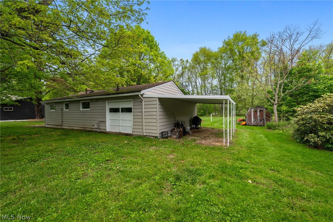 Looking for a lake cottage with an included boat with trailer?   This home in the Atwood Valley community at Atwood Lake is situated on a private 100x100 lot that adjoins the lakefront Muskingum Watershed Conservancy District.  This 2-bedroom home has a renovated bath 2020 with new shower, vanity, commode & fixtures.  The kitchen was renovated with new cabinetry & butcher block counters in 2025 & is open to the living room with wood burning fireplace. The four-seasons room with lake views is a great place to relax on summer days.   Additional features & updates include: LVP flooring throughout 2020, updated electric panel & incoming service to home 2020, storage shed, garage with front & rear overhead doors, attached carport for additional covered storage, public sewer; all appliances, furnishings, kayaks, 14-ft boat with trailer & 12-Month Home Warranty Included!  Boat docking rights are available within the Atwood Valley Dock Association(subject to availability) allowing owner the opportunity to access dock approximately 200ft from the back of property.  Set up your showing today!