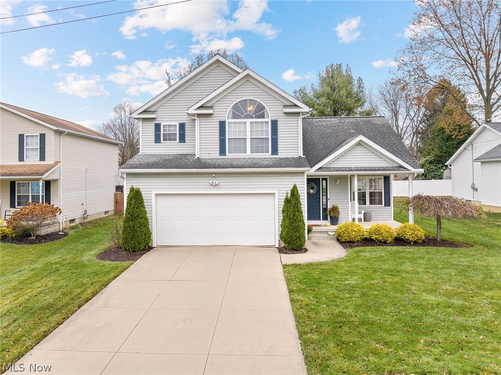 Modern and bright, newer built colonial in Munroe Falls, perfect for entertaining! Vaulted ceiling and gas fireplace in the great room open to the dining area and updated kitchen with island. Convenient first floor half bath.  Upstairs you'll find a spacious owners suite with vaulted ceilings, walk in closet and private bathroom. 2 nicely sized secondary bedrooms and full guest bath complete the second floor.  Modern neutral paint throughout, newer LVT floors, and new light fixtures. Beautiful  stamped concrete patio with fire pit to enjoy warm evenings.  Attached 2 car garage.  Unfinished 12 course basement has tons of potential! Dont miss this one!