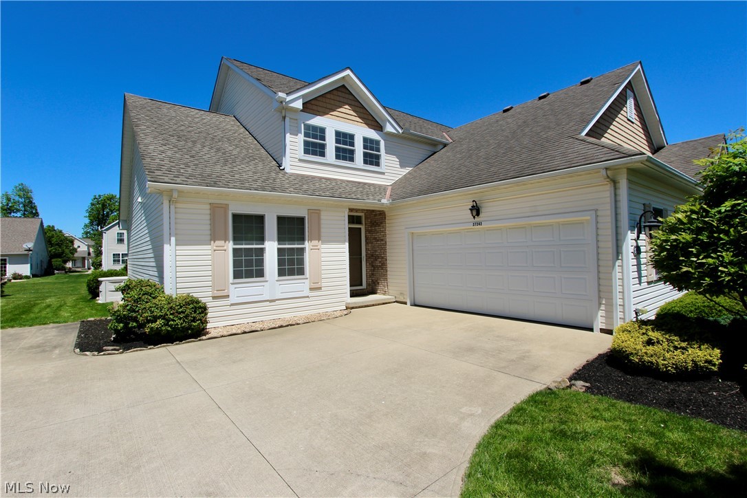 Move-in ready single-family home with 2,443 sq ft of living space (plus nearly 1,000+/- sq ft finished basement). Main level features two bedrooms and two full baths—including a first-floor master suite—an open kitchen, dining area, and a dramatic two-story living room ideal for entertaining. Second floor offers a large bedroom, full bath, and a spacious loft perfect for a home office or secondary lounge. Finished basement provides abundant additional living or storage space, great for holidays and recreation. Enjoy the private patio with retractable awning and a garage finished with nature stone flooring. Recent updates include a newer roof and some new carpeting. Well maintained and ready to move in—schedule a showing today.