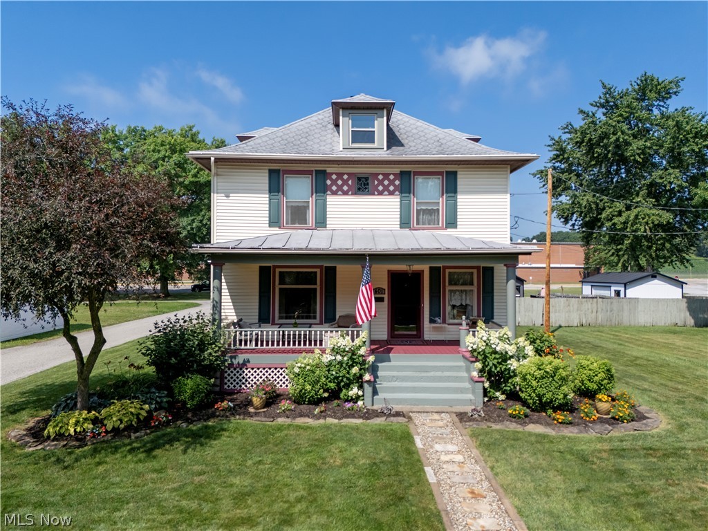Step back in time while enjoying today's modern comforts in this beautifully preserved 1906 Victorian where timeless craftsmanship meets thoughtful updates. Rich original woodwork, stunning leaded and frosted glass windows, and the home's original floor plan showcase the elegance of a bygone era, while extensive renovations over the past six years ensure peace of mind for today's buyer. The updated kitchen features quality KraftMaid cherry cabinetry, Corian countertops, Corian sink. The main level also offers a formal dining room with a cozy gas fireplace, spacious living room, convenient half bath, and the charm of two original staircases. Upstairs you'll find three generously sized bedrooms, an updated full bath with walk-in shower, and a fourth bedroom currently serving as a laundry room (additional laundry hookups are available in the basement). The third-floor attic provides exceptional storage or future possibilities. Outdoor living is just as inviting with a welcoming covered front porch, updated rear deck, professionally landscaped grounds, and a garden courtyard. The detached two-car garage includes a finished bonus space complete with heat, air conditioning, kitchenette, and half bath—ideal for a home business, studio, hobby room, office, or countless other possibilities. This meticulously maintained home has benefited from extensive interior and exterior improvements, including refinished woodwork, updated rear deck, plumbing, electrical, windows, and numerous additional enhancements. A detailed list of improvements is available upon request. A rare opportunity awaits: Buyers may also purchase the home's carefully curated collection of vintage and historical furnishings by separate bill of sale or with individual room collections potentially available. Certain personal items are excluded. This is a truly exceptional home where historic character, quality craftsmanship, and modern updates come together to create something truly special.