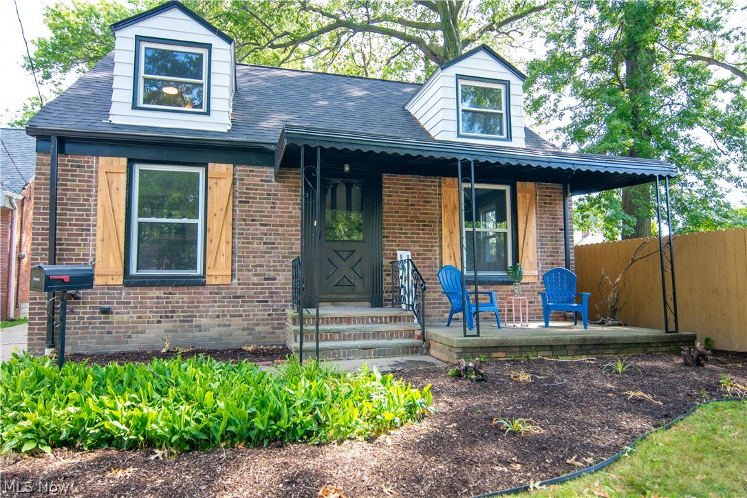 Make this charming home yours! This beautifully updated cape-cod is not sparing details and is as eclectic as they come. As you pull up you will be in awe with the brick exterior and wooded large lot that accommodates this home. The exterior front porch has an overhang patio with lounge chairs to street watch as you please. The back yard spacious for your imagination to run wild has a nice fire pit area and ample parking space. As you walk through the side door you will be greeted by an updated kitchen with blue cabinets, butcher block countertops, newly installed tiled flooring and appliances. Hardwood floors run throughout both floors. Two bedrooms and a full bath finish off the first floor. Tons of storage space and updates throughout the home. The second floor holds the master bedroom with nooks for reading, art and whatever else your heart desires. Equipped with new mechanicals and a finished basement all this home needs is Y-O-U. Schedule your showing today, this one is priced to