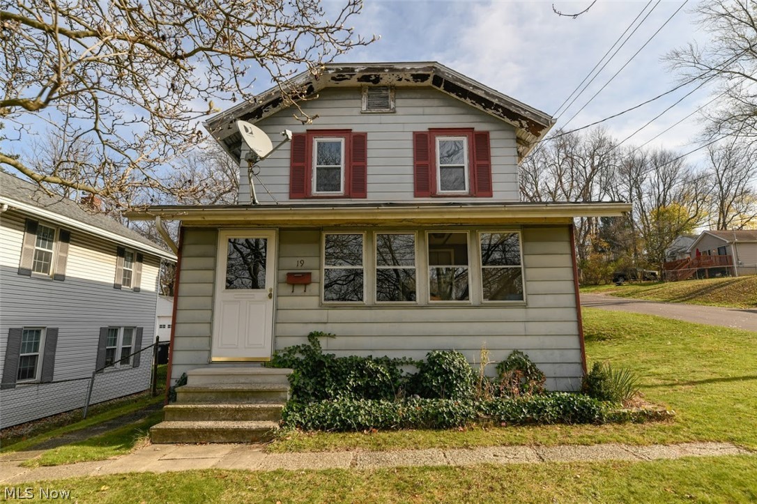 Start you New Year off living in this spacious three bedroom Colonial in Ellet.  This warm home features natural woodwork throughout, the large bedroom on the first floor has a full bath and a sliding glass door that walks out into a 16 x 22 foot wood deck. The laundry room is on the first floor not down in the basement. Two bedrooms with a full bath are waiting for you at the top of the stairs. Appliances are negotiable.