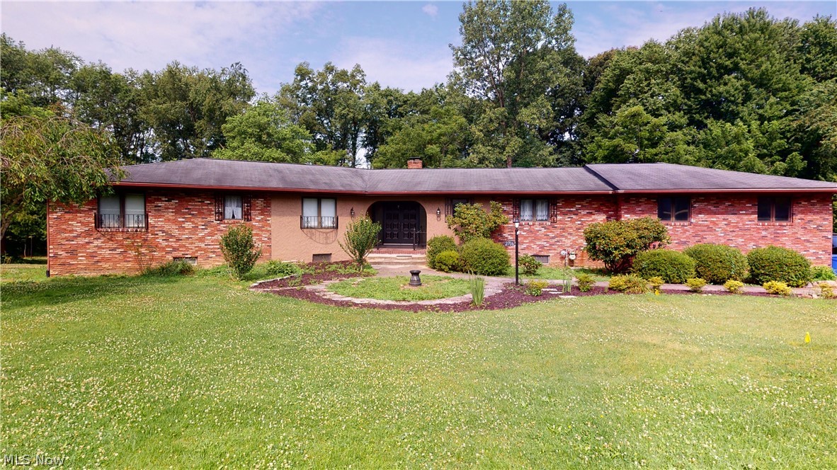 Unbelievable 1-family owned 2020 sqft Ranch with 1198 sqft in finished, walk-out lower level on 1.911 acres!!  Sprawling rooms include formal sunken living room and dining room, both with beamed ceilings and oversized windows overlooking backyard and creek.  Huge applianced kitchen has large eating area with sliders to small deck overlooking backyard, island, desk, window overlooking front yard, entry to attached 2-1/2-car garage, and second staircase to 2nd kitchen/laundry room.  Remaining first floor includes 3 big bedrooms including master bedroom with walk-in closet and 2-part master bathroom, main full bathroom with double sinks and grand foyer entrance with other staircase to finished lower level.  Lower level could be additional living suite with giant fireplaced family room with sliders to patio, possible 4th bedroom, full bathroom with step-in shower, 2nd kitchen/laundry room combo, large rec room, wine storage room, furnace room/workshop with 2nd walk-out to patio.  The overs
