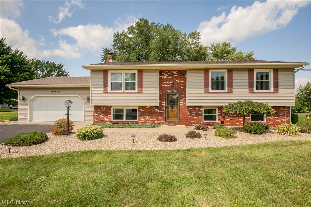 Welcome home to this well-maintained 3-bedroom, 2-bath bi-level nestled on nearly half an acre in Fowler Township. Step inside to a bright and inviting living room filled with natural light that flows effortlessly into the spacious eat-in kitchen, offering abundant cabinetry, generous counter space, and plenty of room for gathering around the table. Just off the dining area, unwind in the screened in back porch overlooking the peaceful backyard, or step outside to the deck and patio—perfect for entertaining, relaxing, or enjoying the scenic views.
Down the hall, you'll find three comfortable bedrooms, including a primary suite with its own private full bath, along with a second full bathroom with a new shower to accommodate family and guests.
The finished lower level offers exceptional additional living space featuring a large family room with a cozy fireplace, an expansive recreation area with a second fireplace, and a versatile bonus space complete with a full kitchen, built-in cabinetry, an additional fireplace, and bar area—ideal for entertaining, a home office, hobby space, or game room. A convenient lower-level laundry area adds to the home's functionality.

Outside, the beautifully maintained yard provides plenty of room to enjoy the outdoors, complete with a storage shed and mature landscaping. A desirable country setting with easy access to nearby amenities make this property the complete package.
Don't miss the opportunity to make this spacious home your own!