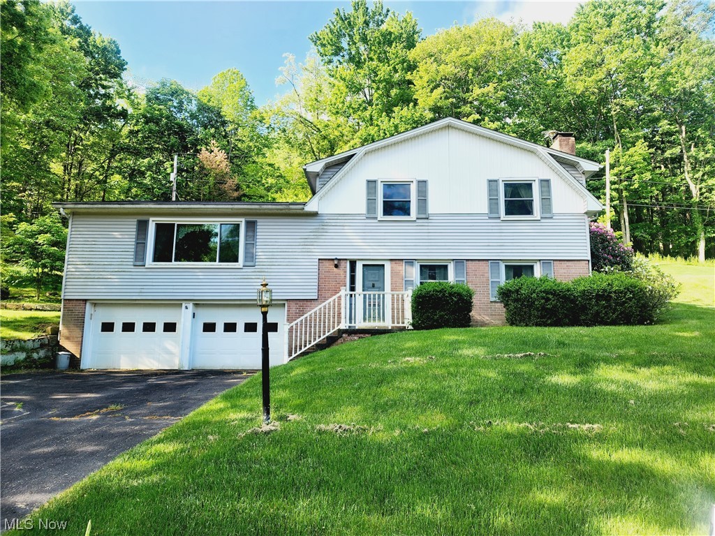Check out this well-maintained split level home near Coshocton city schools. On the lower level it has a large family room with a wood burning fire place and the laundry room which is also a half bath. The main level boasts a living room, formal dining room, and a kitchen with sliding doors out to the sun room. Upstairs you will find three bedrooms and two full bathrooms which have been updated. This home also has a 2 car attached garage. Call today to schedule your showing!