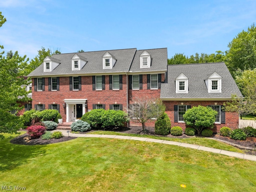 Spectacular and beautiful brick colonial on private 1 acre property in desirable Woods of Wembley neighborhood! Highlights include
recently updated (2023) gourmet kitchen and primary bath, real hardwood floors, spacious rooms & closets throughout, 2 offices and amazing finished lower level. The white & bright designer kitchen features Amish custom cabinetry, large center island with more built in storage, quartz countertops, stainless steel appliances, vaulted hearth room with stacked stone fireplace & skylights, and walk in shelved pantry. The grand great room has a stone fireplace and overlooks the beautiful backyard setting. The front living room (also used as an office with new (2026) carpet to match other carpeting & large formal dining room that opens the the spacious eating space in the kitchen. Off the back hall towards the 3-car garage is a renovated powder room, oversized office with built-ins and huge laundry room with tile flooring. Upstairs there is hardwood flooring in the hall taking you to the four bedrooms and three full baths. The vaulted spacious primary suite boasts a vaulted ceiling and two walk-in closets. Completely updated (2023) primary bath with large walk in tiled shower 2 separate vanities with quartz countertops and private toilet room. The completely finished lower level includes a large recreation room, game area, plus two additional rooms (a possible extra bedroom and exercise room) full bath and extra staircase to the garage. The private backyard is perfect for entertaining friends and family with its paver patios and firepit, tiered deck, lush landscaping and landscape lighting. Other recent updates include hot water tank (2026), air conditioners (2025/2019 ) water softener and purification system (2021) dormer windows and more. This special home is near the Wembley Club which offers swim, tennis, fitness and dining, is close to shopping and in the award winning Kenston school district. Make it your own home sweet home today!
