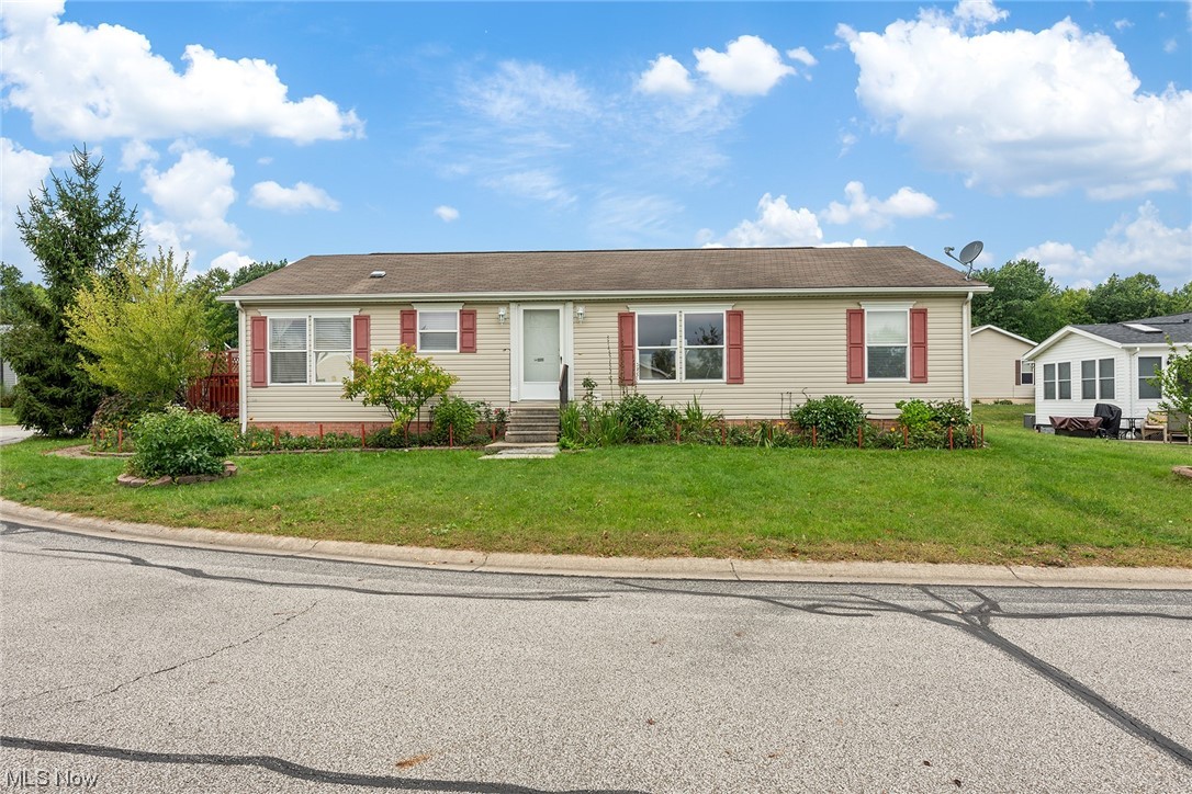 Enjoy easy one floor living in this spacious updated ranch home! The front door opens to a bright and sunny great room with vaulted ceilings.  The great room is flanked by a sprawling eat in kitchen with an abundance of cabinets plus an island, newer appliances and solid surface counters! Nice sized pantry offering great additional storage. Down the hall are the 3 spacious bedrooms all with very good closet space plus an updated hall bath.  The very roomy primary suite boasts vaulted ceilings,  a walk in closet and an en suite bath with a garden tub, double vanities, a stand alone shower and newer toilet. Conveniently located off the kitchen is the laundry/mudroom that leads outside to a charming private deck with newer built accessibility ramp out to the 2 car driveway.  Very spacious yard where you can enjoy your nice sized patio and raised garden beds in addition to established perennials and fruit trees! Plus theres a large shed for any additional storage needs!  Wonderful private community offers access to a beautiful stocked lake, club house and a swimming pool!  So many updates including new furnace and AC in 2018, appliances in 2018, updated plumbing shutoffs both in and out, and replaced skylights to name a few! This home really has it all! Lot rent includes taxes.