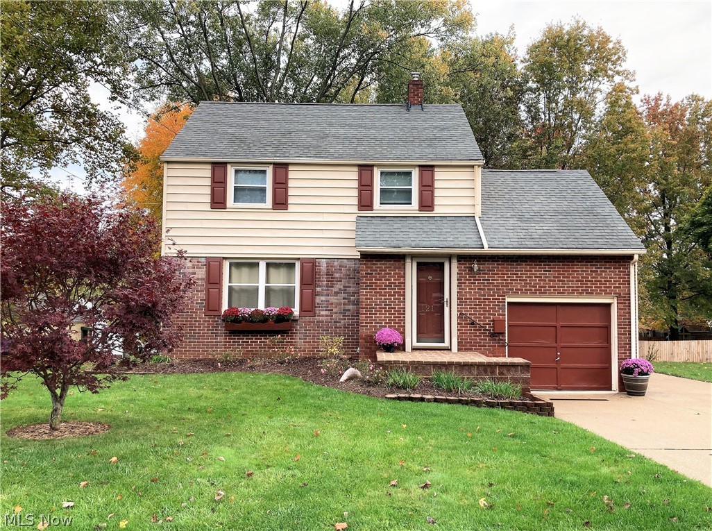 This clean, updated, move in ready home has so much to offer!  Sitting on a beautiful 1/2 acre lot, with gorgeous trees, cute patio area, and yes...even a  window box, this home says "Welcome"!   You will love the spacious living room with great natural light, the dining room with a view of the back yard, and then the kitchen!   Wait until you see this nicely updated kitchen!  Quartz countertops, attractive back splash, plenty of cupboard space, and stainless steel appliances!  Plus a door to your back patio (convenient for grilling), for easy access to your outside space!  Love the bedroom design of this home!  Starting up the stairs you come to a nice size bedroom with great closet space!  Continue on up the stairs to the HUGE master bedroom (bring your king size bed!), the third bedroom, and the updated bath!   A clean, useable basement and attached garage completes this perfect picture!
