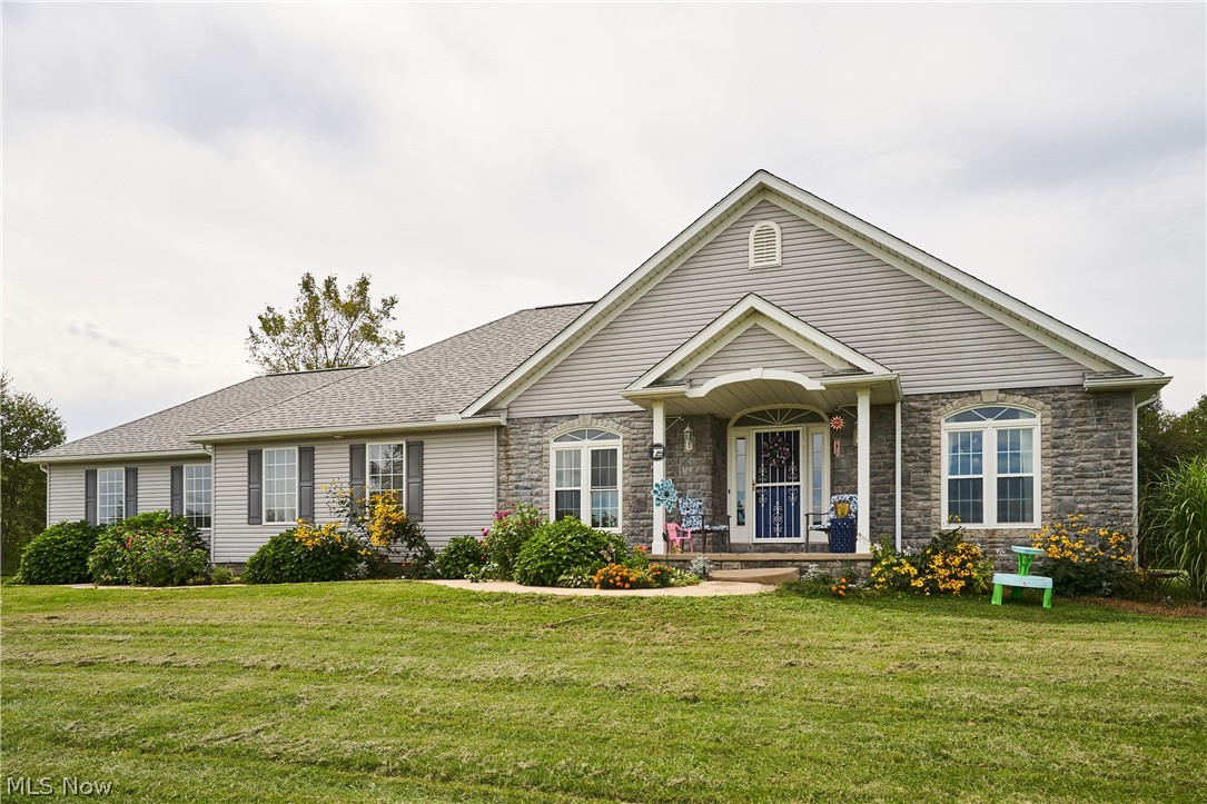 A beautiful 2005 custom built ranch home sitting on 6 acres! Great open floor plan with a split bedroom layout. Huge full basement with two finished bonus rooms. There is an entrance to the basement from both inside the home and the garage. This home includes vaulted ceilings in the living room, crown molding, spacious kitchen with eat-in dining area, formal dining area, gorgeous back deck right off the kitchen, private master bath, an entrance off the master bedroom, and so much more! Plus the enjoyment of privacy! This is definitely a must see! Book your private showing today.