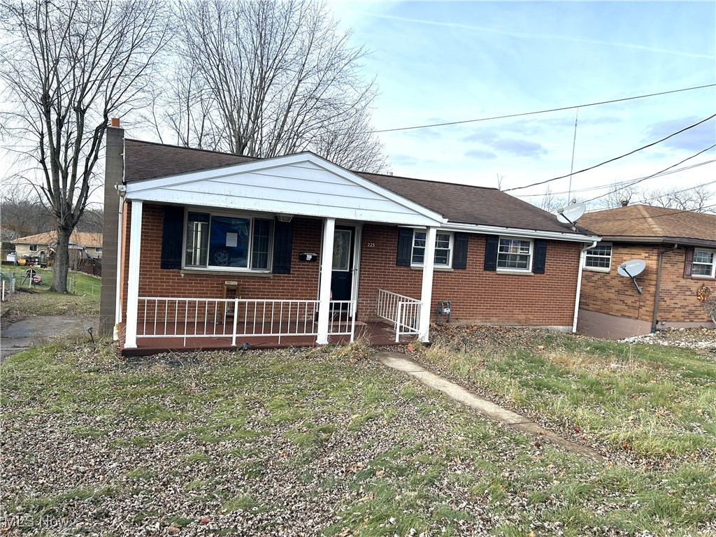 What a find in the village of Mingo Junction!  Great room on rear of home that leads into the kitchen & into the front living room.  Bathroom that can be accessed from the hallway & the kitchen.  3 bedrooms with double closets & hardwood floors.  On the lower level there is a good sized rec room with wood burning stove & an additional bathroom.  Built-in, oversized 2 car garage.