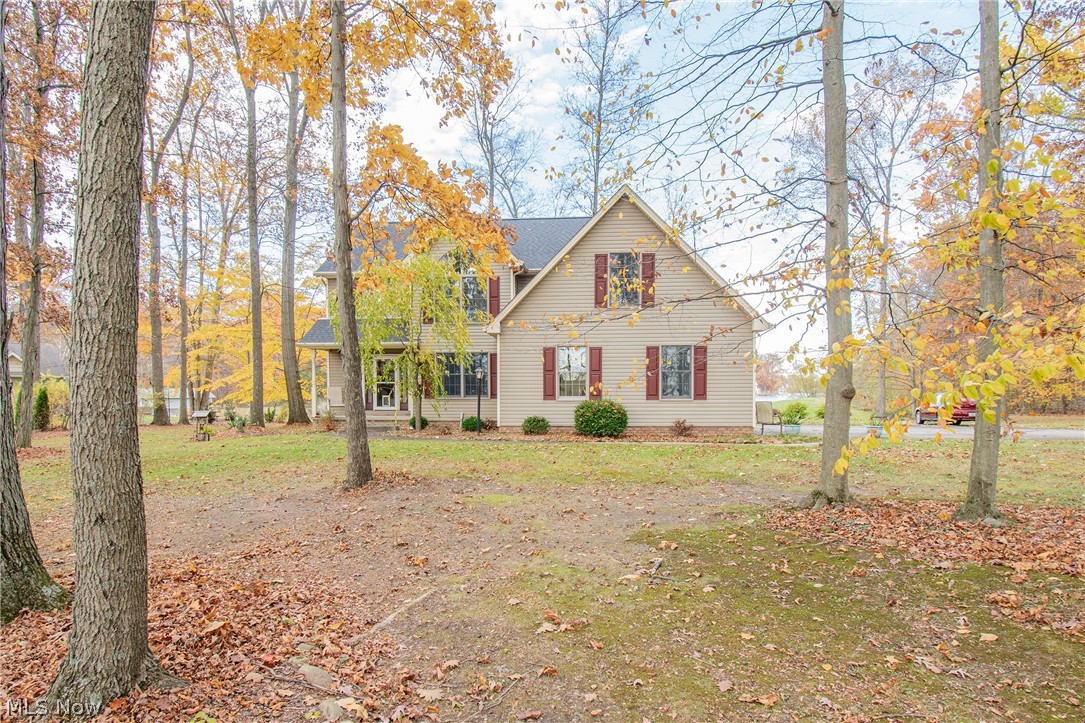 Welcome home to this stunning lakeview retreat! Tucked away on over an acre and accessed by a private road, this property perfectly combines peaceful country living with modern elegance. Step inside the inviting foyer that connects to your cozy living room featuring a gas brick fireplace, and large windows that flows seamlessly into the kitchen and dining area, an ideal space for entertaining or enjoying everyday family life. Sliding doors lead out to the deck, overlooking a slalom water ski course. Upstairs, convenience meets comfort with second-floor laundry, two spacious bedrooms, and a luxurious primary suite. The owner's suite includes a private balcony overlooking the water, walk-in closets, and an oversized en-suite bathroom with dual vanities. Recent updates include new engineered hardwood floors throughout (2025), fully renovated bathrooms (2025), and a professionally waterproofed basement (2024) with a transferable warranty. Don't miss your opportunity to own this beautifully updated and spacious home with serene lake views; your perfect blend of privacy, comfort, and style.