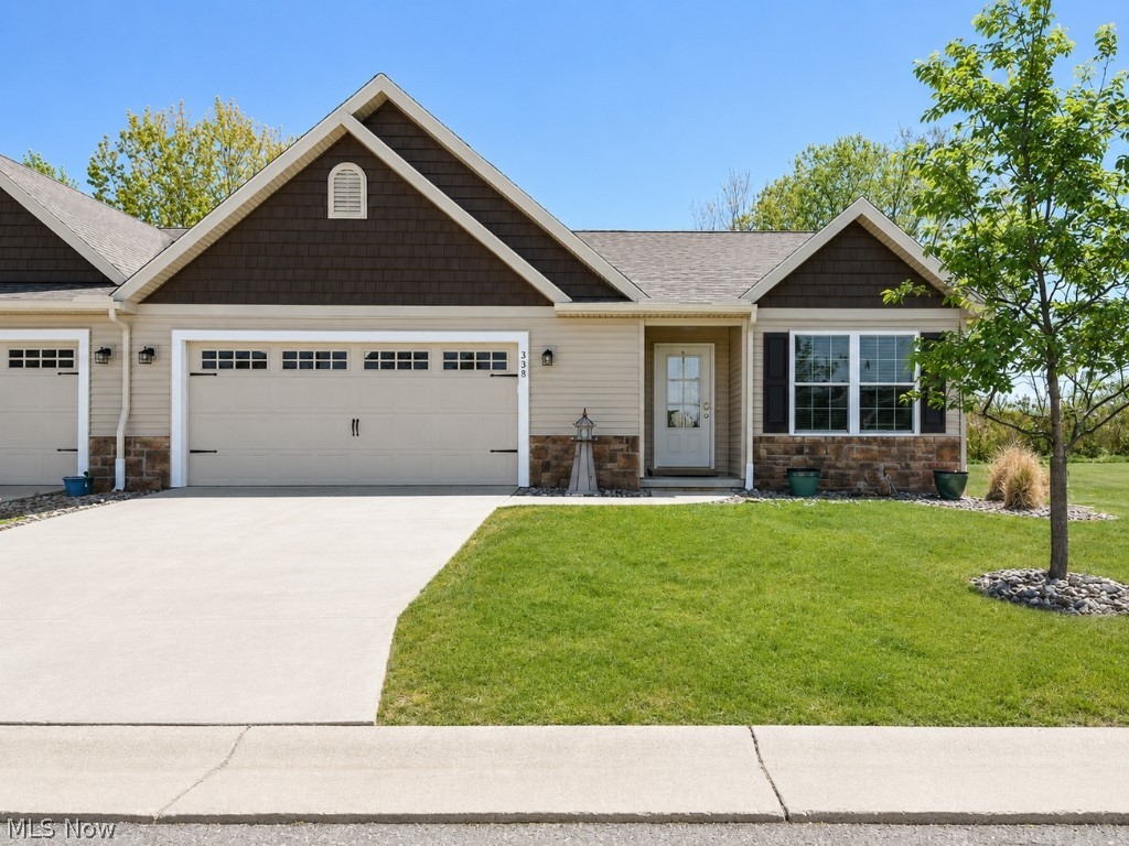 This beautifully maintained one-owner end-unit ranch condo offers the perfect blend of comfort, style, and privacy. Featuring three bedrooms and two full baths, this home is loaded with upgrades and thoughtful details throughout. Enjoy a private yard and attractive exterior finishes including shake siding, stone accents, shutters, and carriage-style garage doors that create stunning curb appeal. Inside, a spacious great room with vaulted ceilings flows seamlessly into the dining area and open kitchen featuring beautiful granite countertops, tile backsplash, breakfast bar, and stainless steel appliances including the range, refrigerator, dishwasher, and microwave. The owner’s suite offers a walk-in closet and private bath with double sinks, granite countertops, comfort-height vanity, and tile shower. The second full bath also features granite countertops and a one-piece tub. The convenient laundry room includes a utility tub along with washer and dryer. Beautiful vinyl plank flooring runs throughout the main living areas, with cozy carpet in the bedrooms. The oversized 2.5-car garage provides plenty of room for storage, plus additional storage space above. Located in a quaint and quiet community, this home is surrounded by one of the most beautiful natural settings along the Great Lakes, offering peaceful living with scenic surroundings.