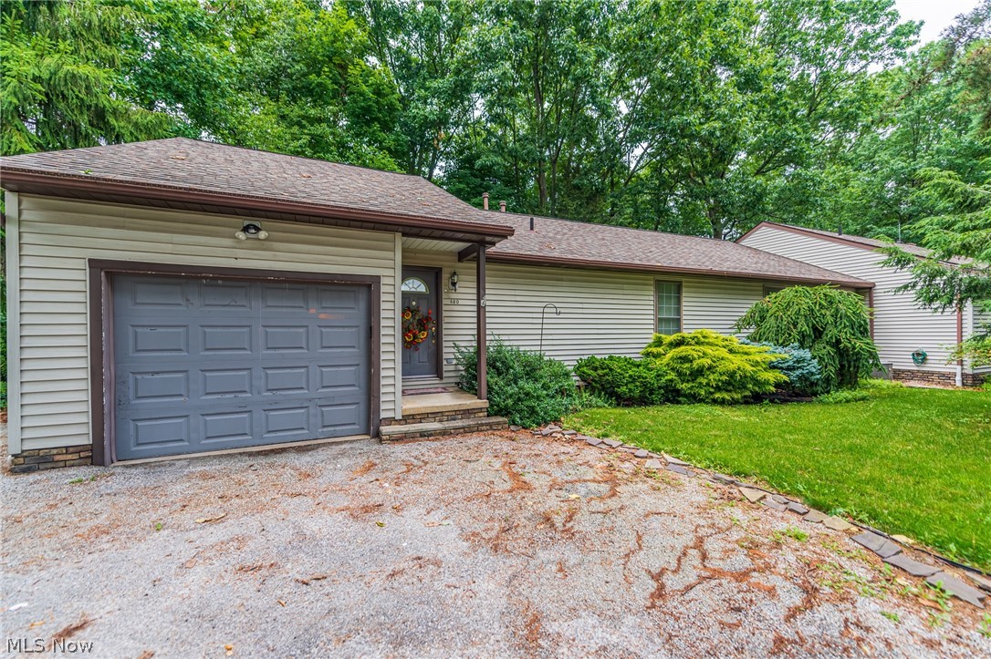 Beautifully maintained ranch duplex located in a private wooded oasis with a relaxing creek running through the property.  This flag lot allows both units to enjoy the privacy and quiet of being away from the road and in the middle of nature.  Each unit is well taken care of with one side previously owner occupied.  Both units have a private screened in porch with full basements.  Larger unit has a beautiful custom built gas fireplace, full kitchen with dine-in area, laundry on the main floor and an additional full kitchen in the basement with bonus room full bathroom!  Storage galore in both sides with an additional storage shed outside.  This one will not last, come take a look!