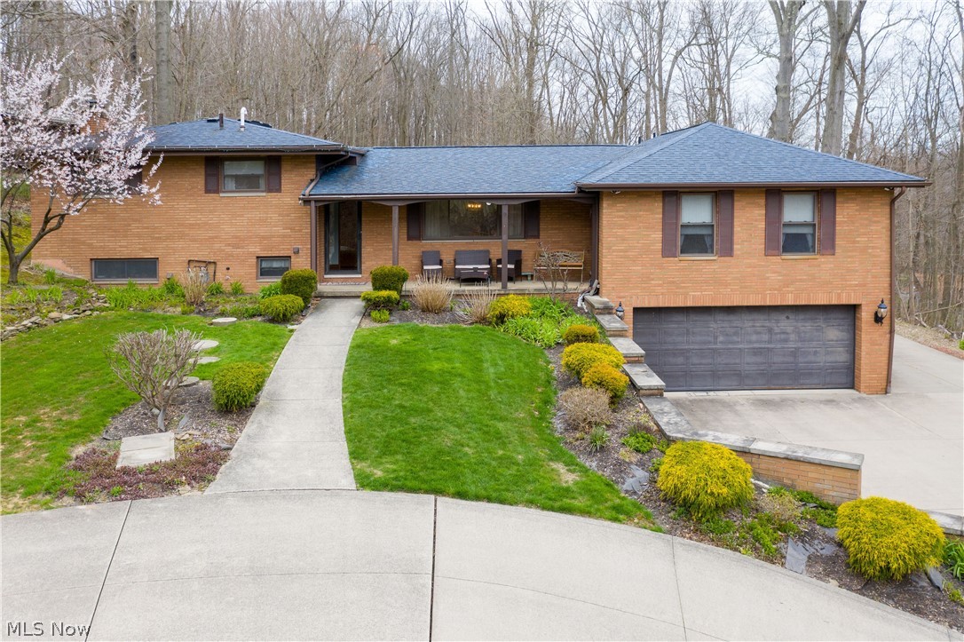 This handsome all brick split ranch style home has 4 bedrooms, 3 full baths & 1 half bath. The first floor has a large eat in kitchen with built-in hutch, fresh paint, access to the deck and beautiful hardwood floors. Next is the spacious dining/gathering room that also has beautiful hardwood floors. The huge 1st floor master bedroom has a walk-in closet, master bath with his & hers sinks, easy access walk-in shower and jetted tub. Finish the 1st floor with a very spacious living room with fresh paint & large windows for natural light. This area could also make a nice space for an In-law. The large family room has new flooring, fresh paint & fireplace. This floor has a nice laundry area and a full bathroom. A few more steps down and you will enjoy a very large finished recreation area with plenty of room for a pool table or wherever your imagination takes you. There is also a 1/2 bath, a large mudroom that goes out to the backyard and access to the heated 3 car garage. Upstairs is a fu