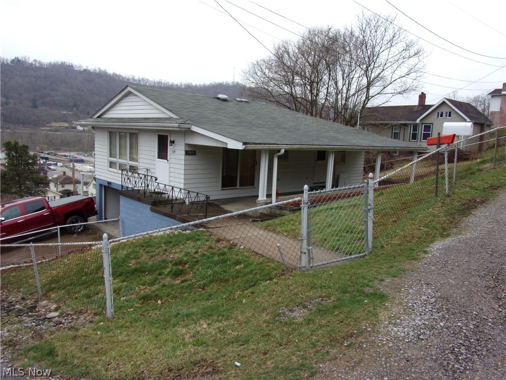 Three Bedroom, one bath ranch, wood burning fireplace, one car garage plus carport, located in Brookside.