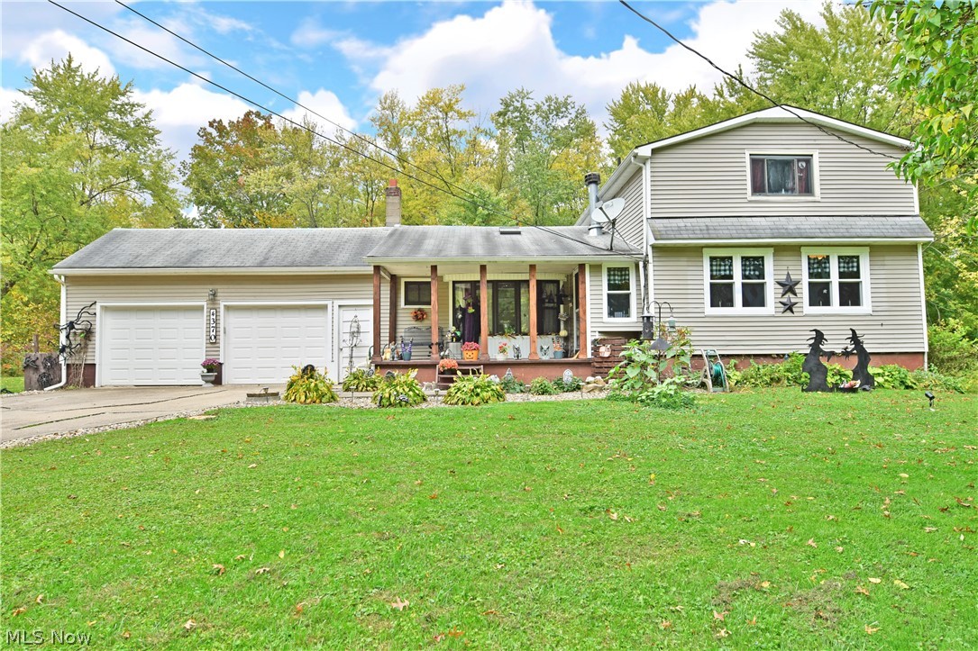 A perfect place to call home; let this sprawling four-bedroom Leavittsburg residence take you in and delight you with its inviting rooms and sizeable property! This well cared for residence boasts relaxation in and out, starting with a lovely and pillar lined, covered front patio. Inside, hardwood style flooring fills the cozy dining room where contemporary country design cues continue into the charming kitchen waiting just around the corner. Here, countertop space includes casual, bar top seating as a large serving window looks down into the masterful, lovely living room. Tall, stepped ceilings tower above while sunlight pours in from the bay style picture window. A woodburning fireplace makes those cool fall nights a breeze. A pair of first floor bedrooms include the master bedroom found just down the main hall, joined by a shiplap trimmed full bath and first floor laundry. Opposite, a half bath is located near the second story staircase that leads to a pair of loft style bedrooms. 1