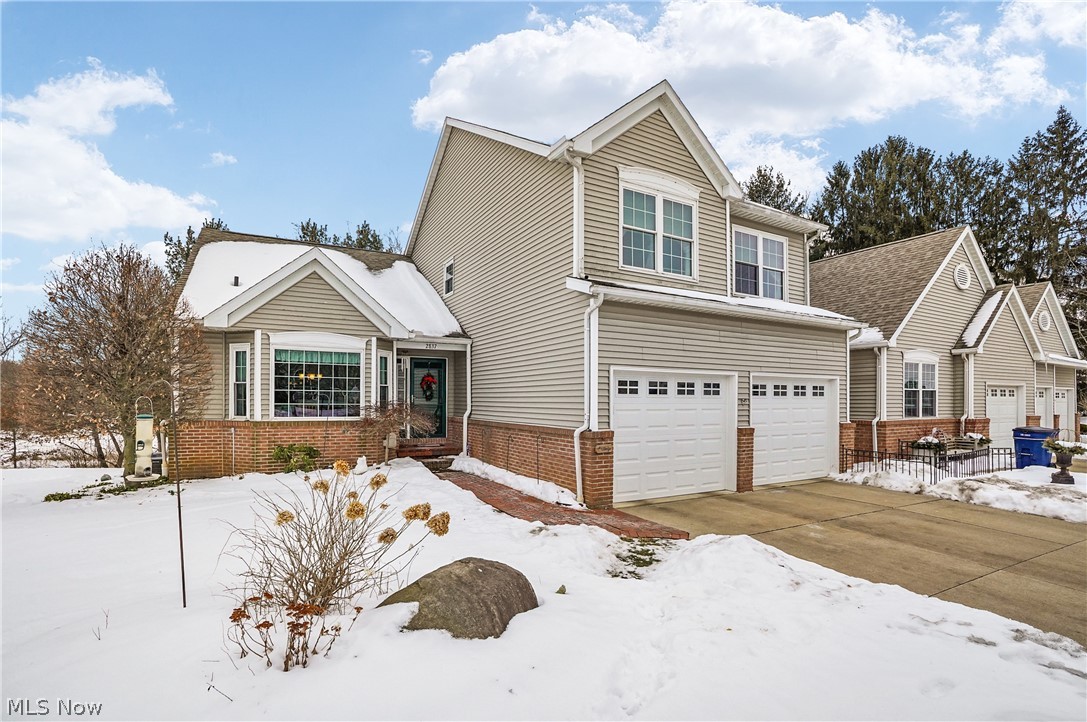If you’ve been waiting for a first-floor primary suite and a layout that truly works for everyday living, this home is worth a closer look.

A bright, open floor plan centers around a cozy living room with a fireplace, with additional space to spread out in the family room and the enclosed porch. Step right out to the deck off the porch, perfect for morning coffee or easy entertaining.

The eat-in kitchen features built-in appliances and plenty of room to gather. On the main level you’ll also find a private den, while upstairs offers a loft area that works well as a second living space, office, or hobby zone.

The finished walkout basement is a standout, complete with a bar, abundant storage, and a full workshop area, giving you the extra space buyers keep asking for, plus a patio leading to a private backyard.