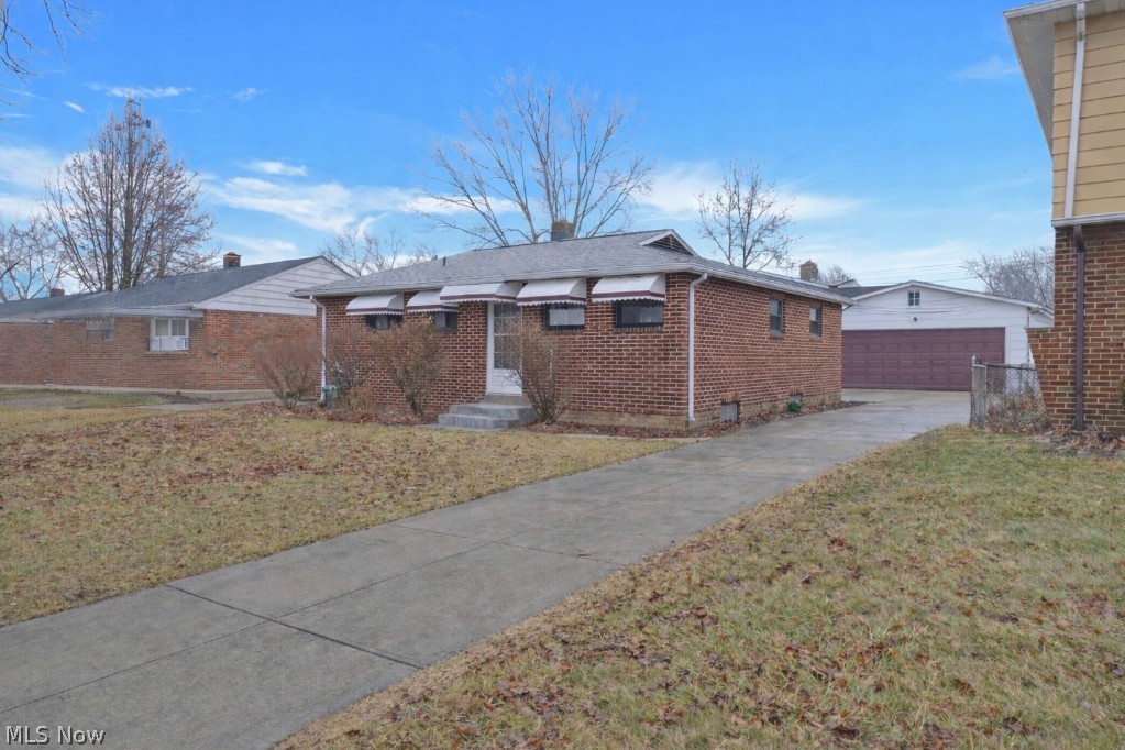 Welcome to this beautiful 2 bedroom, 2 full bathroom brick ranch in Brook Park! This features a large sized 2-car garage with additional storage space and a shed in the back with a long concrete extended driveway and a nice closed in 3 seasons porch along with a new roof and gutters! As you walk in you will notice the refinished and well maintained hardwood flooring throughout the 1st floor bedrooms, living room and dining room. The kitchen has large luxury tile flooring, brown cabinetry, butcher block countertops and a full stainless steel appliances set with a separate breakfast bar area that opens nicely into the dining room and the front living room! Through the dining room you will see the burgundy three seasons room with sunlight through the surrounding windows. The basement is fully finished out with a large rec room, a bar, dedicated laundry room and another finished room that could be used as a 3rd bedroom is desired. The furnace, electrical box and hot water tank are new. This has a brand new sidewalk as well and it has no Point of Sale violations. Come check out 6377 Ledgebrook today!