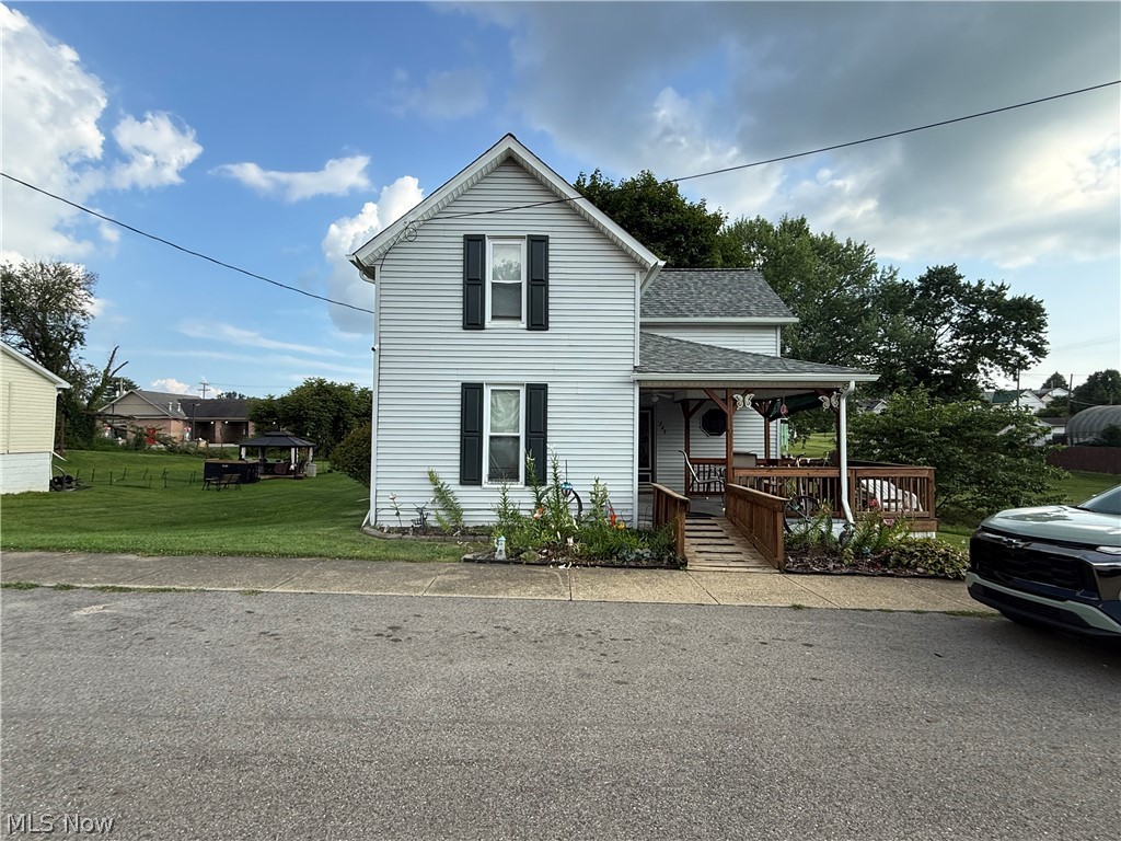 Great location for this 3br. 1 1/4 bath with spacious eat in kitchen and first floor laundry, oversized living room and master on the main floor.   This well maintained home has been freshly painted inside with neutral colors and newer laminate flooring.  The first floor bath has new tub/shower and toilet.  Comes fully equipped with all appliances to stay in this large oak kitchen.  Enjoy the outside space as well with the front covered porch with new carpet and railing, nicely landscaped and 2 oversized sheds will stay for added storage.  Also there's a one car garage in the basement and plenty of storage and the 1/4 bath downstairs with workshop area. The large back yard has a partial fence for separation for privacy and plenty of space to store your extra toys.