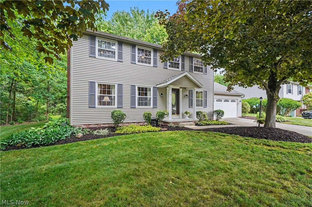 Welcome to this spacious and very well maintained center hall colonial in Heritage Heights.  This 4 bedroom, 2.5 bath home offers a formal living & dining room, a fully applianced, eat-in kitchen that opens up to the family room with a cozy fireplace for those cold winter Ohio nights.  Right off the family room is a wonderful 15x15' Sun room with attached spacious deck (great for entertaining and BBQs) overlooking the large yard and the wooded area of the 280 Acre Silver Springs Park right in your back yard! On the 2nd floor you will find 4 spacious bedrooms.  The primary bedroom offers a good size walk-in closet and full bathroom with shower.  The three other bedrooms share the nicely updated 2nd bath, all rooms are neat, clean and nicely decorated.  Enjoy the large recreation room in the lower level that is about 23x26.  There is also a laundry room and workshop. This is nice "Out of the way" community of well maintained homes and is within a short distance to Stow campgrounds, bow-wow beach dog park, fishing lake and hiking trails.  Current owners have been here approx 36 years and they know you'll love the area! New sump pump with battery backup (2025), new water heater (2023), gutter guards.