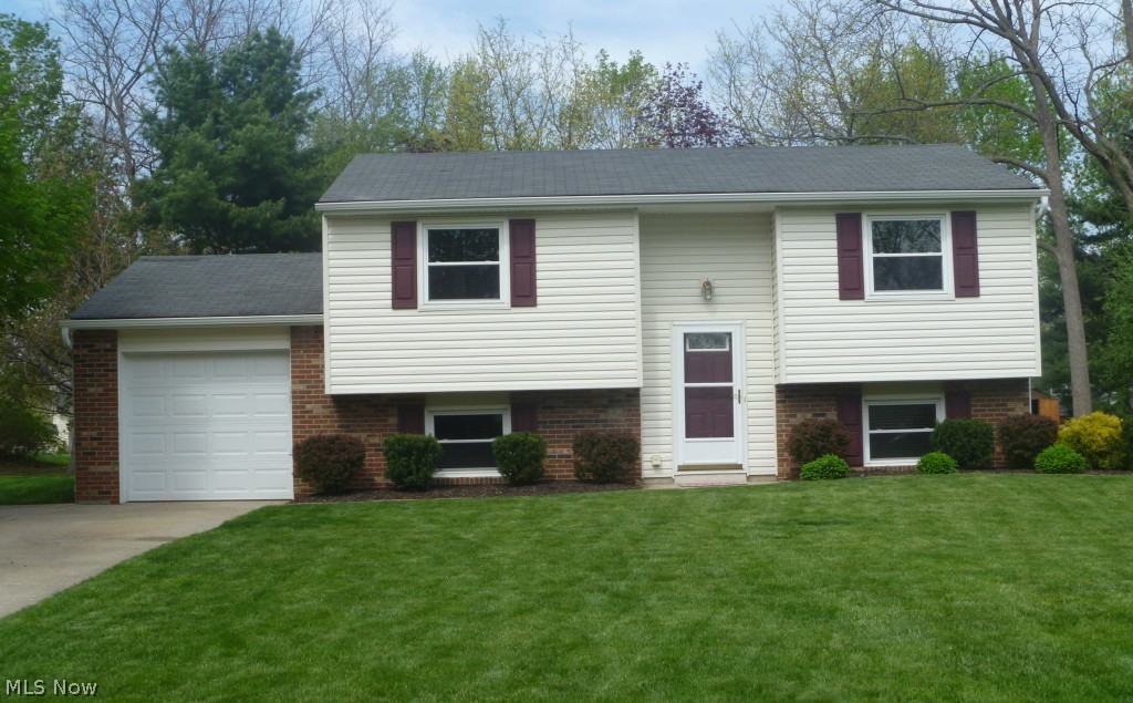 Fantastic 4 bedroom 2 full bath bilevel in excellent condition! Updated throughout with tasteful décor. Formal living and dining rooms  plus family room. Nice deck overlooks large scenic backyard. Newer kitchen, bathrooms, furnace, AC, vinyl/shutters/ gutters, windows, electric, water heater, garage door opener with keypad and wood blinds throughout. Convenient location, award winning schools. All you have to do is just move in and enjoy!