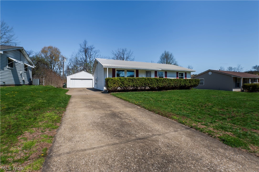 Welcome to 1993 Kelsey Dr in Cuyahoga Falls, a well-maintained ranch that offers a rare combination of comfort, functionality, and location. Situated on a 0.20-acre lot, this 3-bedroom, 1.5-bath home features 1,290 square feet on the main level, along with additional space in the basement that includes a convenient extra shower.

One of the standout features of this property is the hard-to-find four-car detached garage. This is a rare opportunity within the city and is perfect for car enthusiasts, hobbyists, extra storage, or a dedicated workspace.

Inside, you will find a bright and inviting layout highlighted by a spacious sunroom filled with natural light. This versatile space includes venting for a wood burner and tile flooring beneath the carpet, offering the potential to create a cozy year-round retreat. The kitchen comes fully equipped with brand-new appliances, and the washer and dryer stay with the home for added convenience.

Step outside and enjoy peaceful views as the property backs directly to Kennedy Park, creating a private and scenic backdrop that is not commonly found in a neighborhood setting. A welcoming front porch and a covered back deck provide great options for relaxing or entertaining.

Located in the Cuyahoga Falls City School District and just minutes from shopping, dining, and everyday conveniences, this home offers a great balance of quiet surroundings and accessibility.