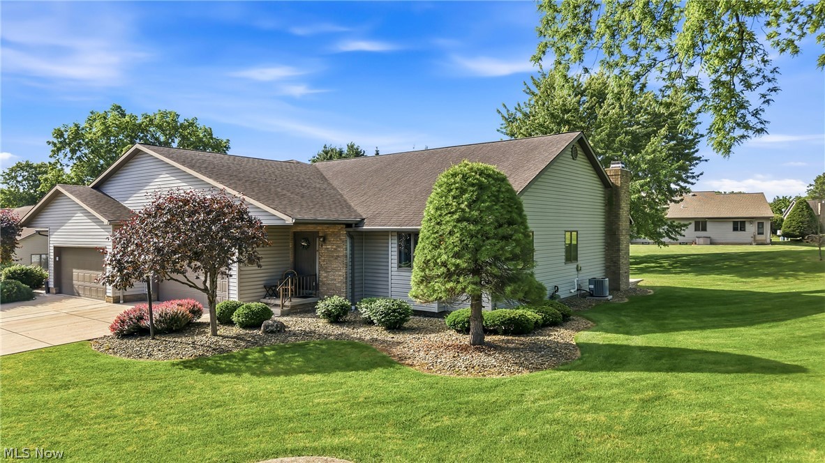 Welcome to Whispering Meadows, one of Howland's most sought after communities. This spacious ranch condo has a contemporary design with vaulted ceilings and an open floor plan. The large great room has neutral carpeting and adjoins the dining area. You will appreciate the gourmet kitchen w/beautiful oak cabinets, pantry, ceramic tile and breakfast bar. The family room features a gas fireplace and has access to the new, large back patio. There are 2 bedrooms, 2 full baths, w/the master bedroom having 2 double closets and a large private bath with walk-in shower and double sinks.  Additional features are a first floor laundry, full basement, and an attached 2 car garage. New furnace and air conditioning was installed in 2022. This desirable neighborhood is close to shopping, dining, medical facilities and churches.