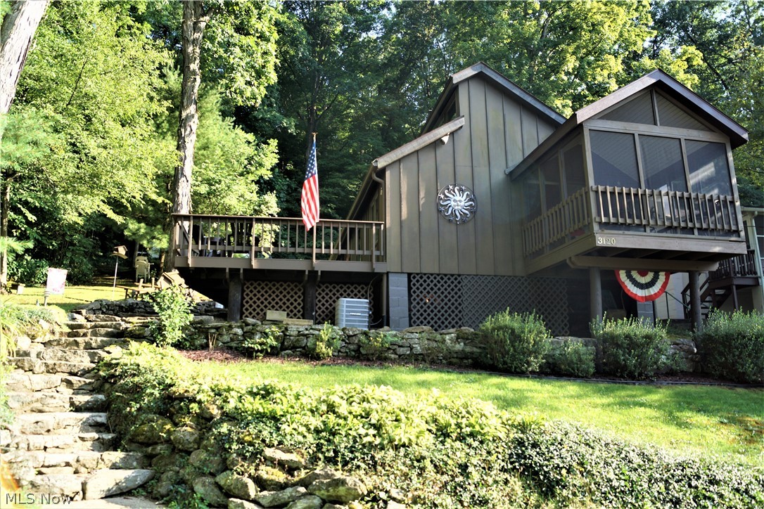 Social Distance in Style with this adorable and cozy cabin on private land at Leesville Lake! Peace and Serenity await! Enjoy lake views from your screened in front porch while drinking your morning coffee. Charming kitchen comes with stove and refrigerator. Open concept! Large living and dining area with a wood burning fireplace! 2 bedrooms and 1 full bath. Large deck with lots of privacy! This cabin in the last one on the street which offers you nothing but beautiful Muskingum Watershed woods next door! Electric forced air furnace with air conditioning makes your stay very comfortable! Newer hot water tank. Meticulously maintained! Live, Love, and Laugh life at Leesville Lake! 1000 acres of the best muskie fishing around! Rockwood Park has it's own private beach area too. Dock included with this sale.