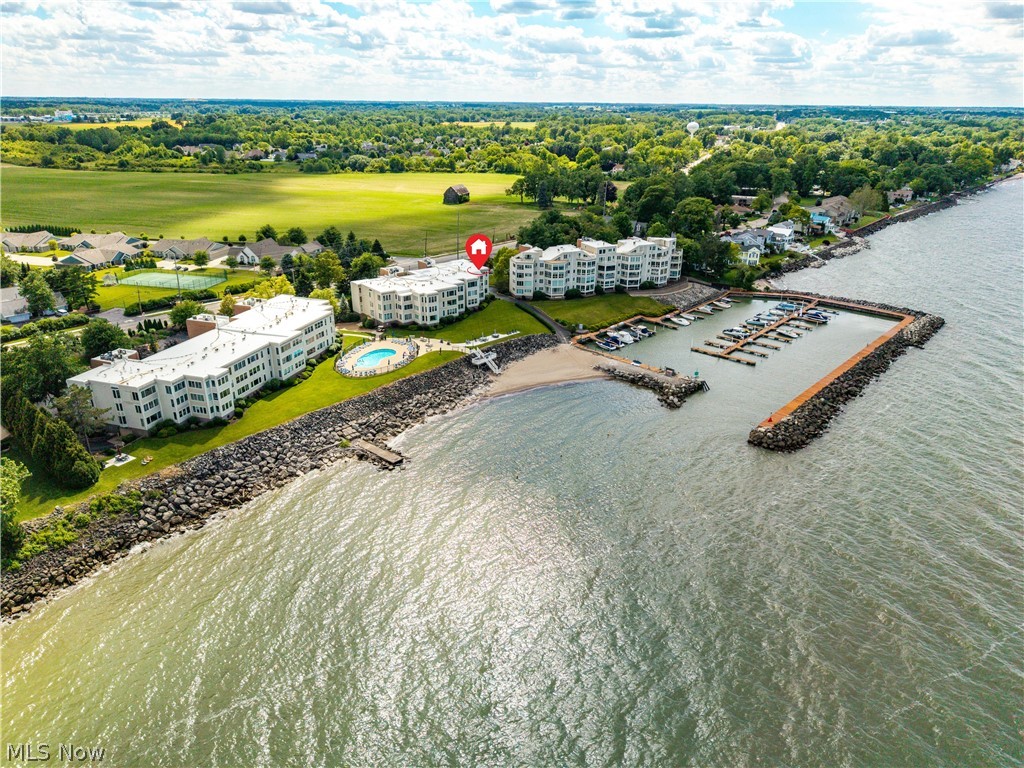 Enjoy lakeside living at its finest in this beautifully maintained 1-bedroom, 1-bath condominium at Beachwood Villas in Huron. This top-floor corner unit offers breathtaking views of Lake Erie, the private beach, and the marina, while the additional corner-unit windows fill the home with abundant natural light throughout the day.

Recent updates provide peace of mind, including new windows, HVAC system, and water heater, all installed within the past year. The thoughtfully designed layout maximizes both comfort and views, creating the perfect retreat for year-round living or a seasonal getaway.

Convenient storage options include a private storage closet just outside the unit, plus a dedicated space in the underground parking garage with room for a vehicle and additional storage for beach gear, bicycles, or even jet skis.

Residents of Beachwood Villas enjoy an exceptional collection of resort-style amenities, including a swimming pool, private beach access, marina, tennis and pickleball courts, and grilling areas with outdoor patio space perfect for entertaining family and friends.

Whether you're watching the sunrise over Lake Erie, relaxing on the beach, or enjoying the waterfront lifestyle, this rare top-floor corner unit offers an outstanding opportunity to own a piece of Huron's coveted shoreline.