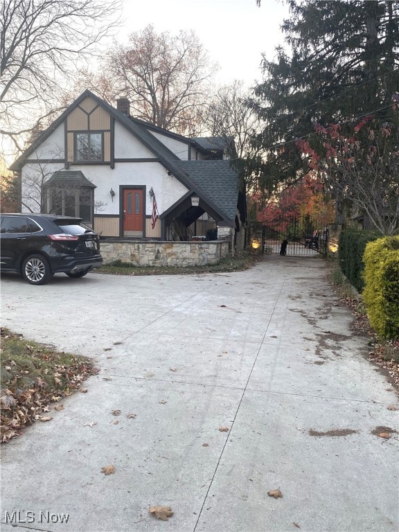 Beautiful modified home & property with many updates between 2000 and 2015. Old cottage/bungalow style house that has been converted to 3,800 square feet Tudor Style property that has 4 bedrooms and 4 full bathrooms. Several vaulted ceilings and large rooms throughout..  New high end windows throughout the home. Walls are 2 x 6 construction heavily insulated. 1 wood burning fireplace, 1 gas fireplace, and 1 wood burning stove. Huge master bedroom with oak flooring and attached master bath that features jacuzzi soaking tub. New carpeting on 2nd floor in bedrooms. A beautiful 4 Season room with marble floor, 3 skylights, cedar loft ceiling, and 2 ceiling fans. Also has 2 bonus rooms that can be used for extra living space.  Plenty of space for a growing family.  Portion of the home could be easily converted to an in-law suite.