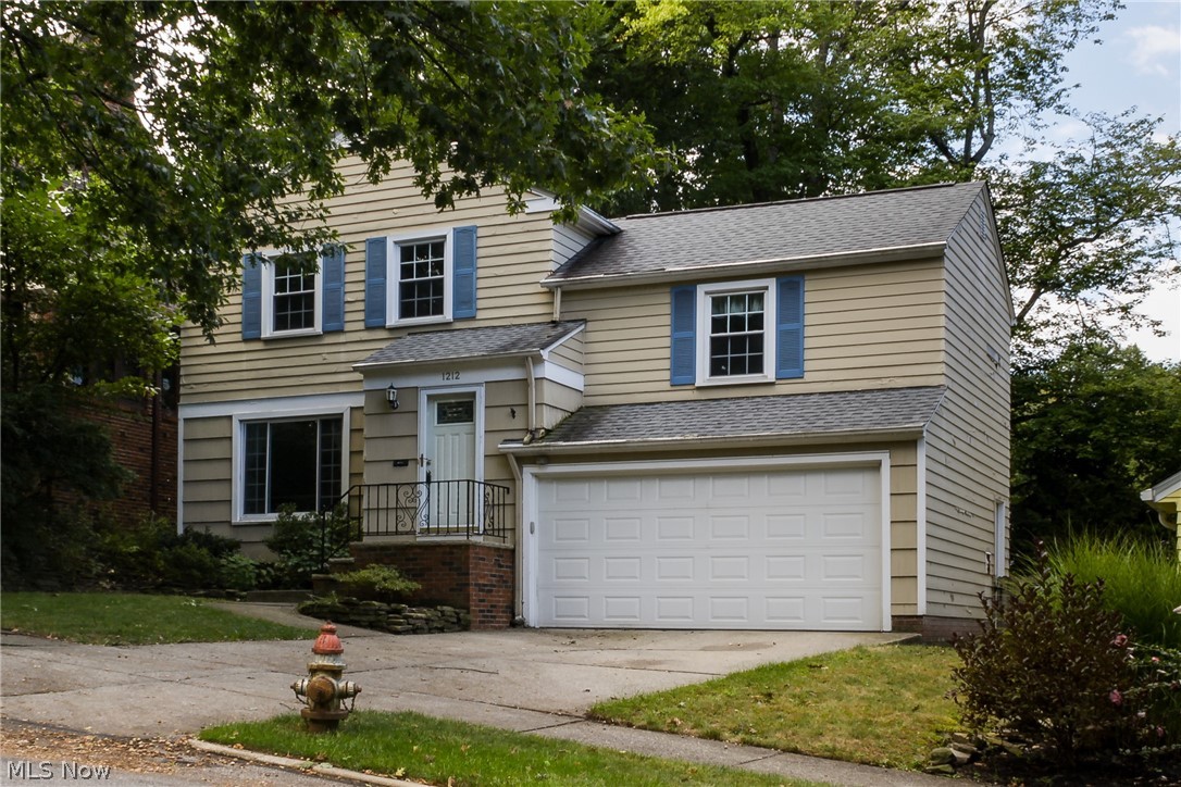 Welcome home to this classic colonial with a family room addition and a 2 car attached garage! Enter through the front foyer into your sunny living room with a large picture window and gleaming hardwood floors.  The living room opens to the formal dining room and the updated and fully applianced kitchen.  Towards  the back of the home is a spacious family room that leads out to the beautiful patio and back yard!  A convenient half bath finishes off the first floor. Upstairs are very nicely sized bedrooms with great closet space and a full bath. Fresh paint throughout.  2 car attached garage! This home has so much to offer and is move in ready! Dont miss it!  Call your favorite Realtor today!