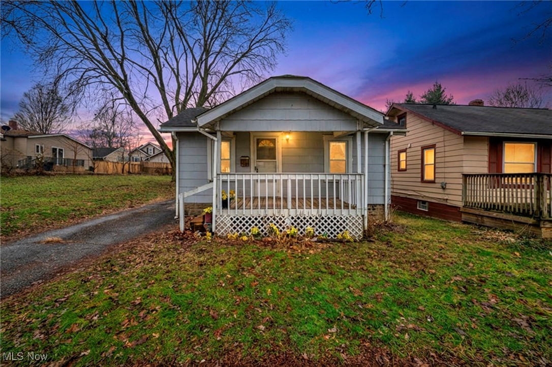 Come and fall in love with this quaint ranch style cottage in a pocket neighborhood located off of Waterloo Rd. in Akron. An asphalt drive, with plenty of room for parking, leads you to a 1.5 car garage and a partially fenced-in yard. This home is ready for its next chapter and to be filled with love and laughter again. Schedule your tour today. New paint throughout, new countertop and newer windows, hot water tank replaced in 2023, and roof replaced in 2007.