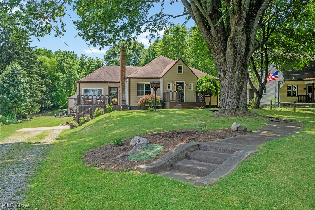 Nearly 2 acres in Perry Local Schools, and she is cute as can be! From the moment you pull into the driveway, you'll appreciate all the love & care that has gone into making this house a home.

As you walk up, you'll be welcomed by two charming front porches, perfect for your morning coffee. Step through the new front door installed in 2025 & you'll immediately notice the fresh paint & beautiful new flooring installed in 2024.

The spacious great room flows into the kitchen, creating the perfect gathering space. As with every well-designed home, the kitchen sits in the center, the heart of the home where family & friends gather. Beautifully designed, it also features a new range hood installed in 2024.

Down the hall are three comfortably sized bedrooms with updated lighting & thoughtful paint colors. The full bathroom is full of charm with beautiful sconces adding the perfect finishing touch.

The inviting living room showcases a beautiful fireplace, making it the perfect place to gather, relax with a book, or enjoy your morning coffee.

The basement offers plenty of storage, a laundry area, & a tandem two-car garage. Additional updates include newer vinyl replacement windows, a radon mitigation system, & new glass block windows installed in 2026.

Step outside onto the large deck overlooking your nearly 2-acre property. The backyard also features a two-story barn, perfect for equipment, recreational vehicles, or your dream workshop.

If you've been dreaming of country living with modern updates & room to spread out, this Perry Local Schools home is one you won't want to miss. Schedule your private showing today!