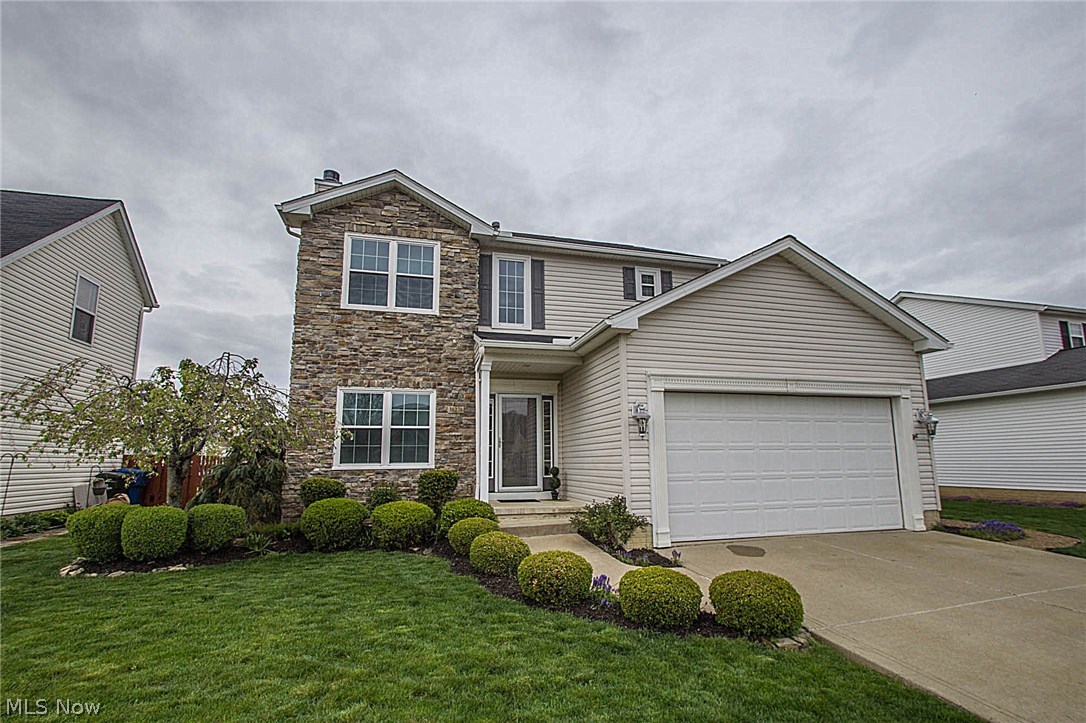 You don't want to miss over 2,300 sq. ft. of living space with many upgrades to this beautiful Colonial located in the much desired Meadow Lakes development in North Ridgeville. The home features 3 bedrooms and 2.5 baths. Upgraded high-efficiency Allside double hung vinyl windows that feature the ease of tilt in sashes for easy cleaning and maintenance. Once inside this well appointed home you will see the open floor plan that features a gas log fireplace in the great room. The kitchen offers solid wood Cherry cabinetry with granite countertops. The eat-in style kitchen also features an island and stainless steel kitchen appliances. Refrigerator, stove, dishwasher and microwave are all included. First floor laundry room off the kitchen. Master bedroom features a walk-in-style closet with ample storage space. The master bathroom was updated in 2016 and includes a separate shower, tub and double sink vanity cabinet. The finished basement includes a family room/bonus room. The basement in