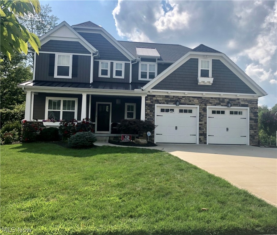 Absolutely stunning home with all of the extras and upgrades!  Open concept from 2-story great room with entire wall of windows looking into nature, fireplace, and awesome ceiling fan to the highly appointed kitchen with stainless steel appliances and HUGE island w/plenty of seating, granite counter tops, walk-in-pantry and dining room w/wall of windows.  Laundry room is huge with plenty of storage area and laundry chute from the 2nd floor.  As you walk in the woodcraft front door into the hand scraped wide planked hardwood foyer, it is flanked by a home office/study/library that is accented with 6' wainscoting and 9' ceilings.  The mud room is right across the hallway with built-ins that leads from the garage.  The kitchen has all of the bells and whistles with many upgrades consisting of great lighting, granite counter tops, plenty of storage, easy to close cabinetry tot he large open dining area with a wall of windows and a door to the exterior deck.  The second floor has three larg