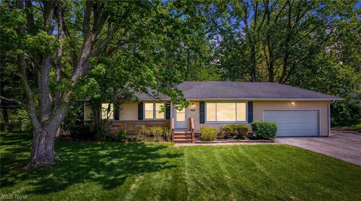 This one was made for you. Set on just under an acre in Mayfield Village, this move in ready ranch puts you in one of Northeast Ohio's most highly rated school districts, minutes from Cleveland Clinic's Hillcrest Hospital, Legacy Village shopping and easy highway access, all while coming home to a beautifully updated home with room to breathe.
This is not your typical ranch. With 4 bedrooms, 2.5 updated baths and a finished basement, the layout is full of personality from the moment you walk through the new front door. The large living area flows into the kitchen, and tucked between the two is an adorable built in cabinet and custom mosaic shelf that is truly one of a kind.
The updated galley kitchen features quartz counters, crisp white cabinets, modern fixtures and a stylish gold faucet, opening to a charming round dining nook perfect for everyday meals. Just beyond, the most impressive room in the house awaits. A large vaulted space with quartz counters, floor to ceiling windows, skylights and custom glass door cabinets. A sliding glass door opens to the expansive backyard, making this room an entertainer's dream.
The master suite is privately situated off this vaulted space with its own full bath and custom tile shower. Three additional bedrooms and 1.5 updated baths are tucked down a separate hallway, offering a smart layout for families or guests. New LVP flooring ties every space together beautifully, and the large finished basement adds generous living space and storage.
Outside, nearly an acre awaits.
Move in ready, loaded with updates with a new roof, HVAC and some newer windows, this one will not last. Schedule your showing today
